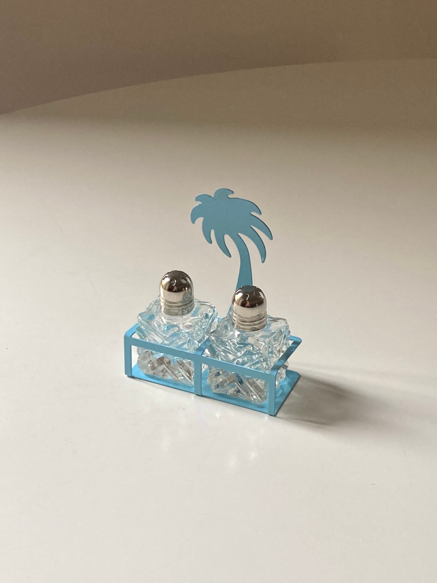 Pair of palm-shaped salt and pepper shakers