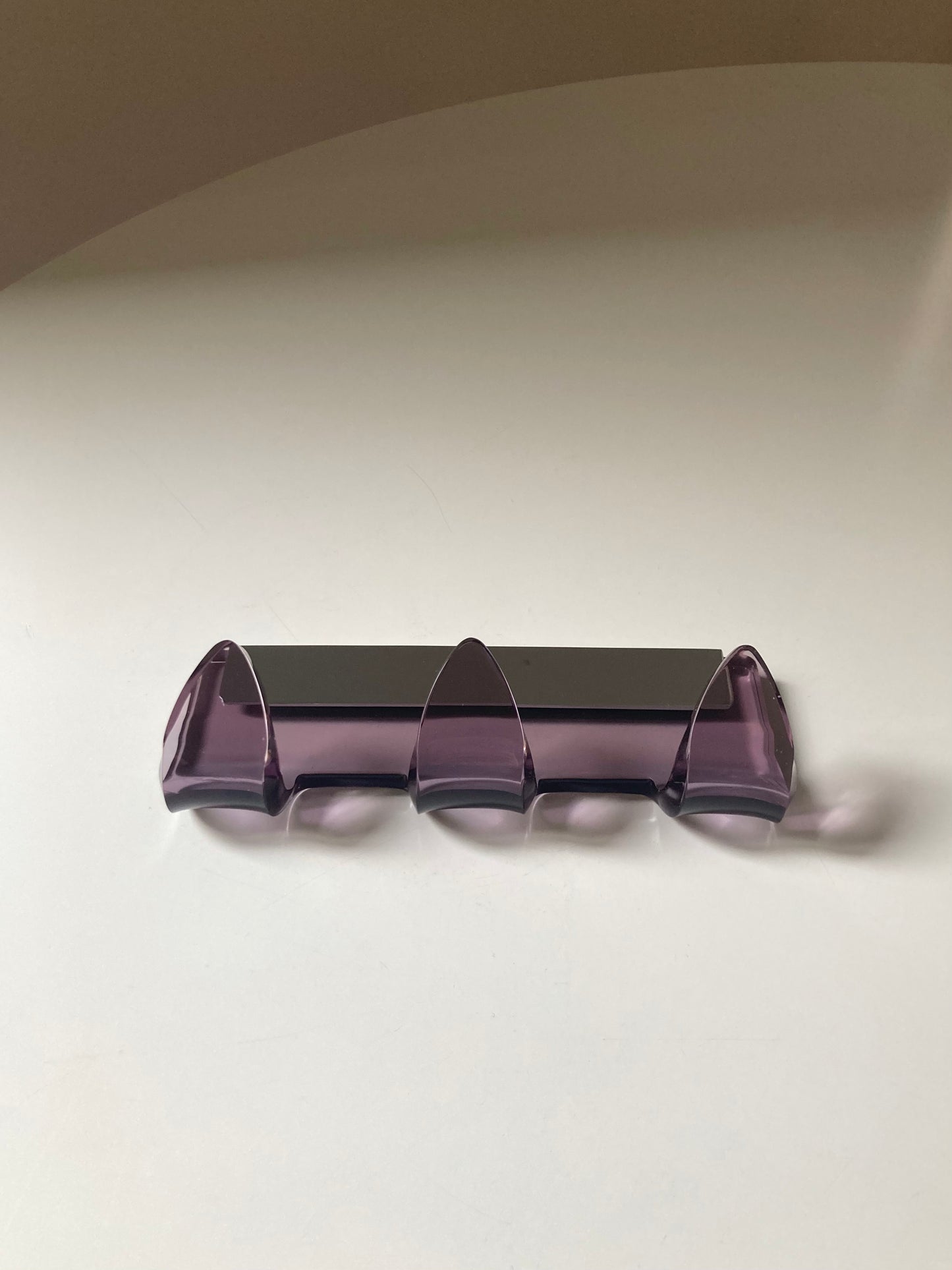 Mauve colored designer coat hanger