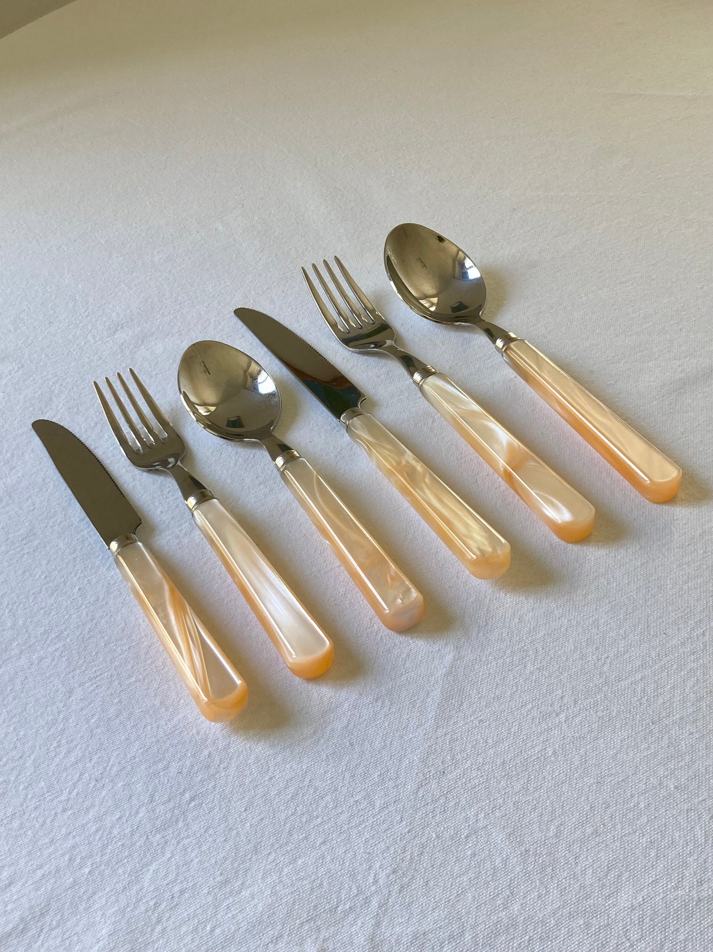 Pearly ivory colored table cutlery and dessert service