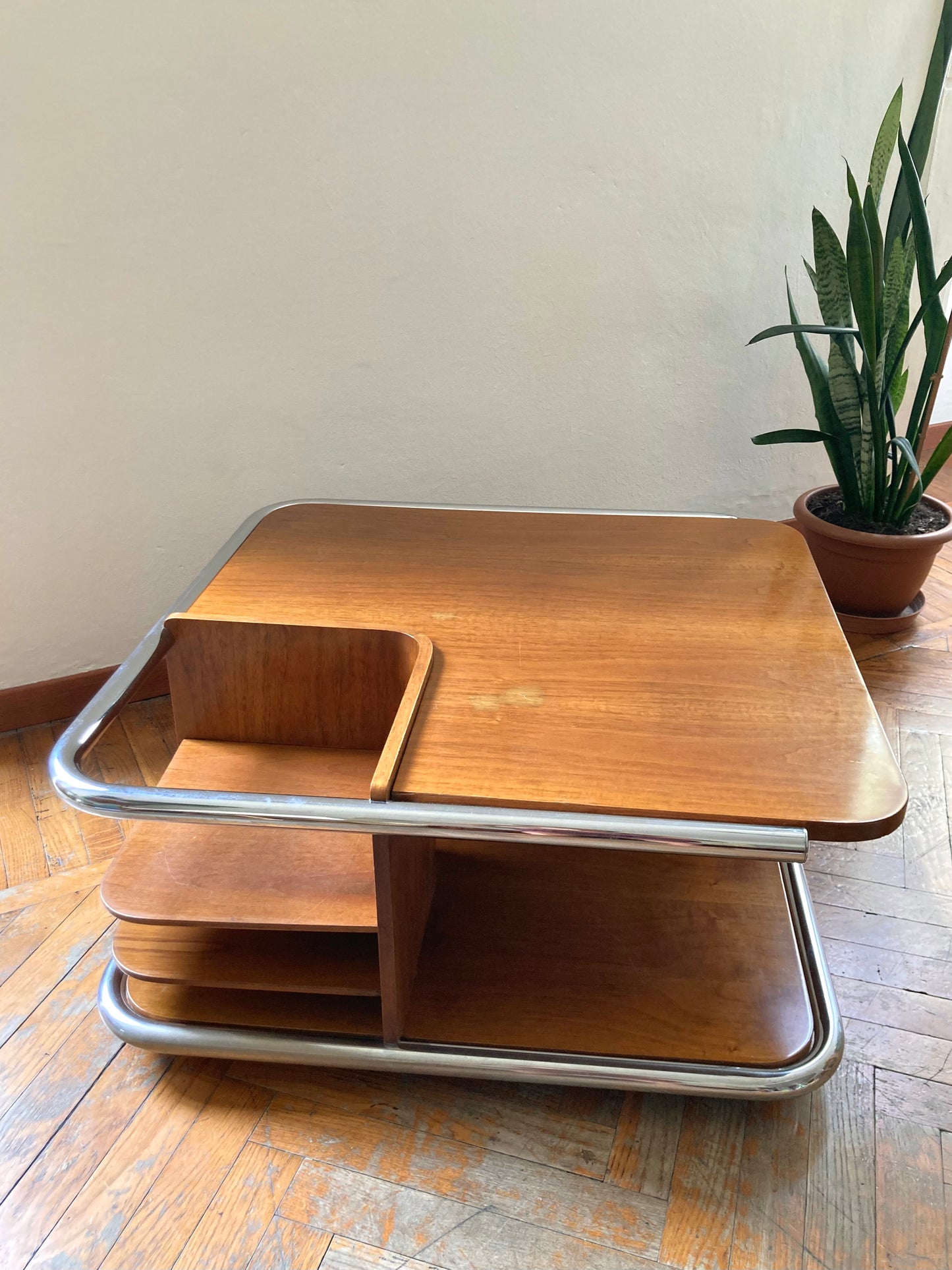 Square wooden coffee table with chromed profile