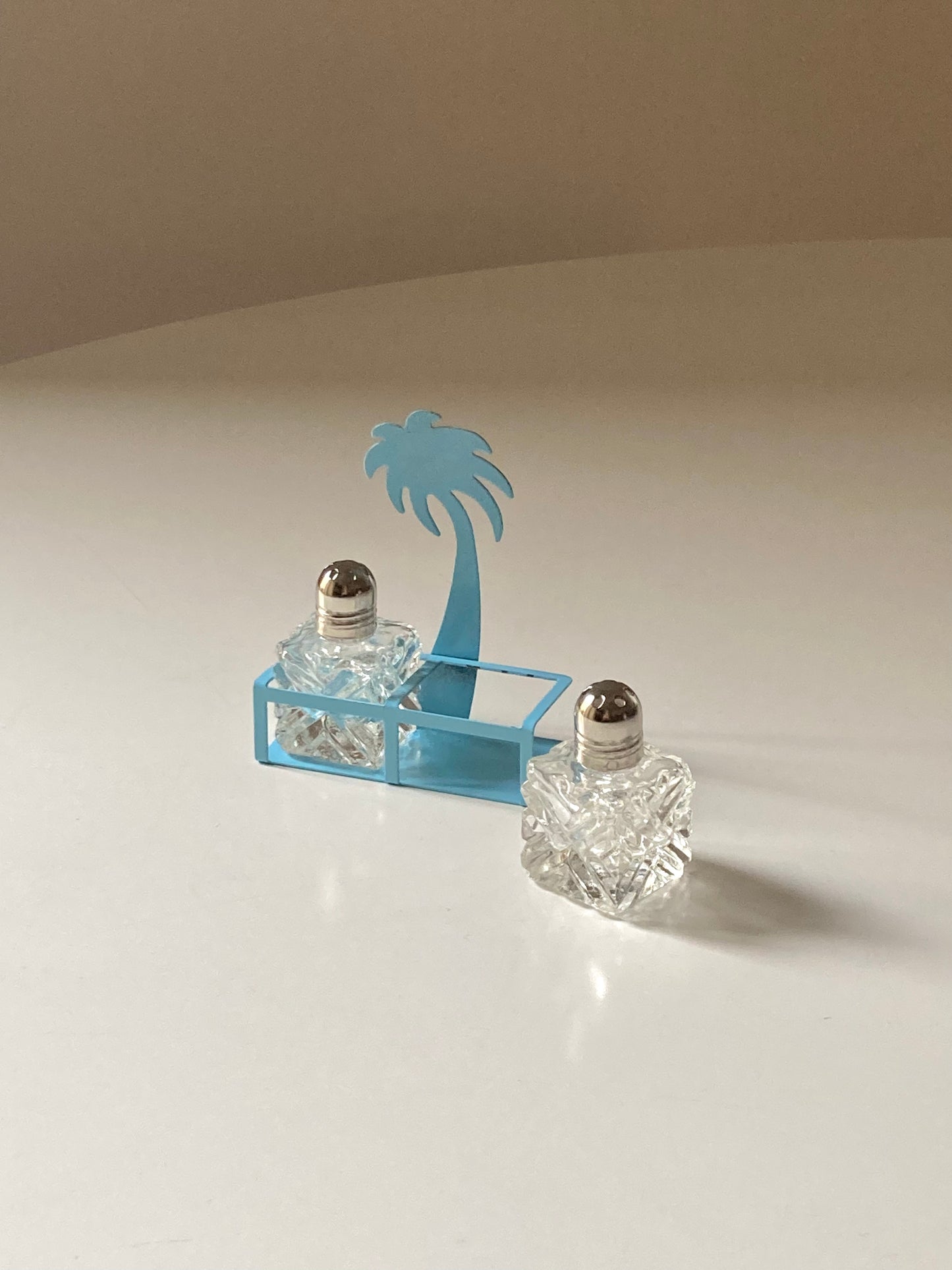 Pair of palm-shaped salt and pepper shakers