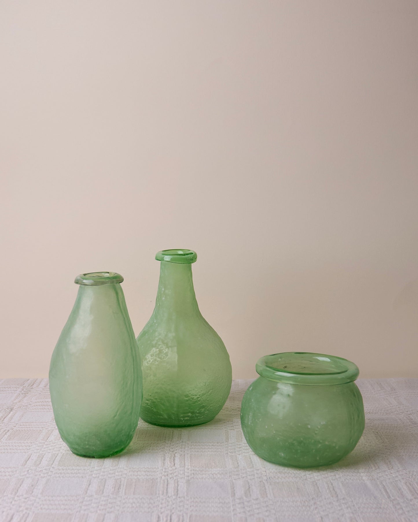 Trio asymmetric vases in green glass