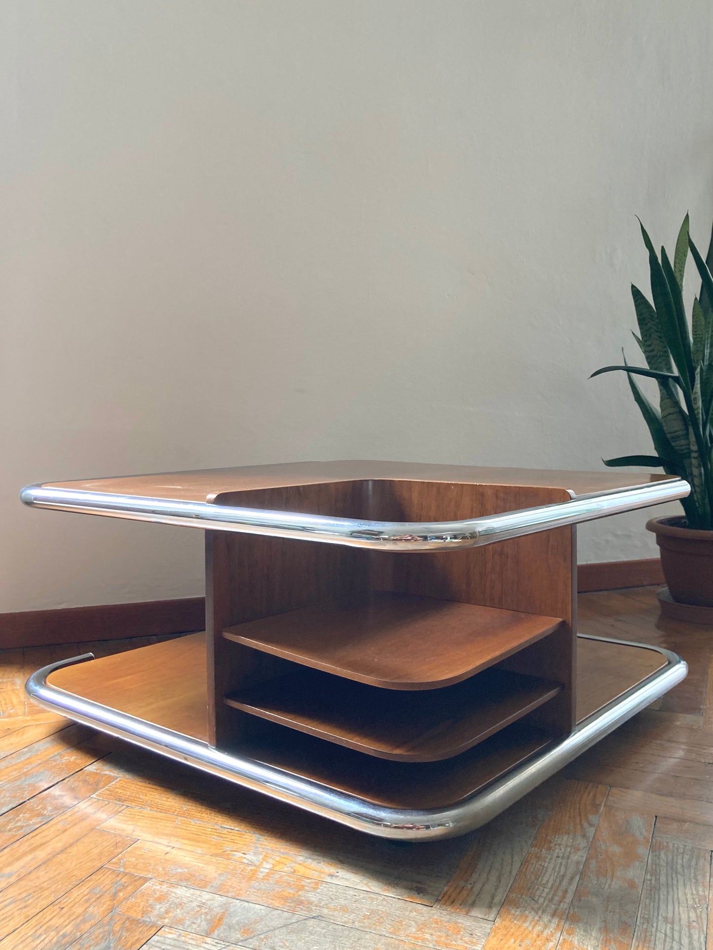 Square wooden coffee table with chromed profile