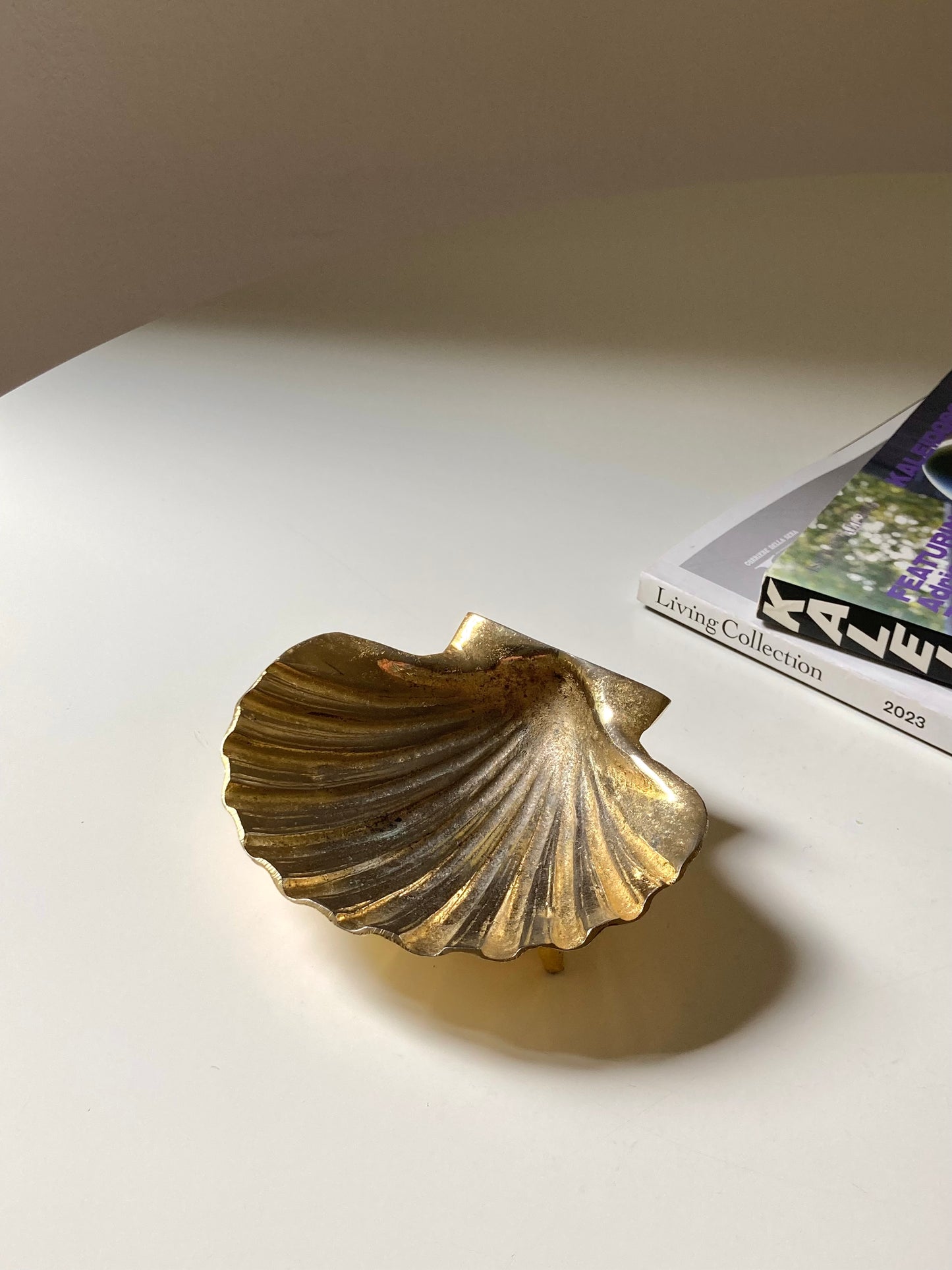 Golden shell-shaped ashtray