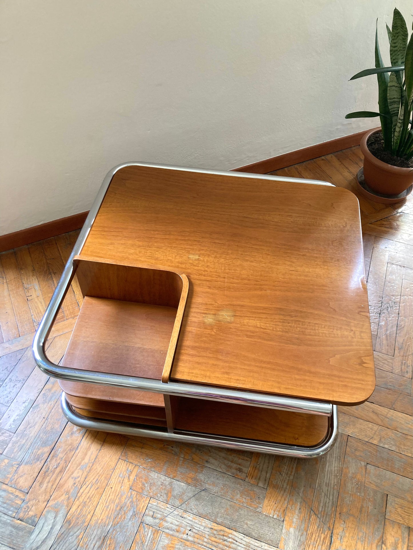 Square wooden coffee table with chromed profile