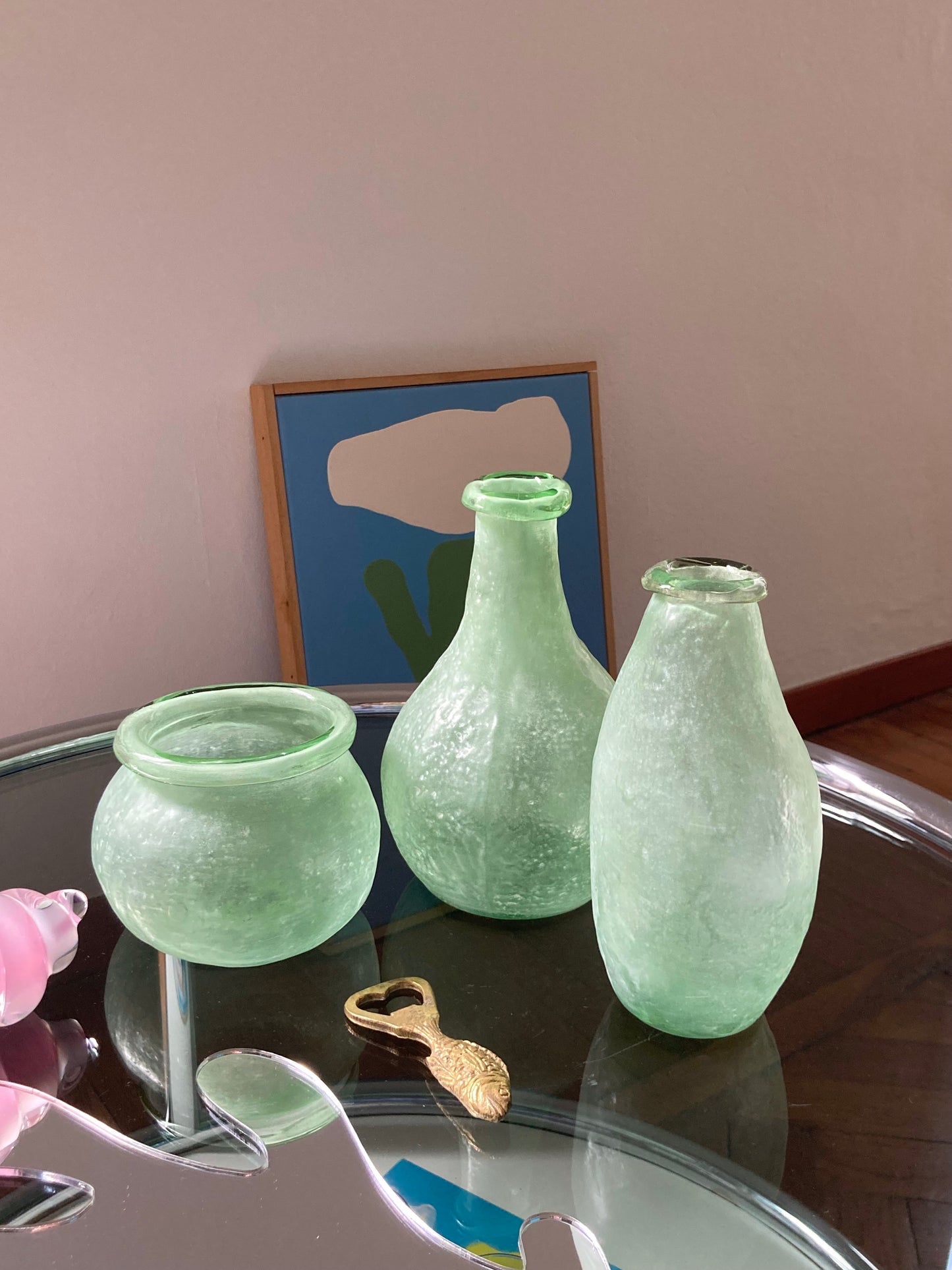 Trio asymmetric vases in green glass