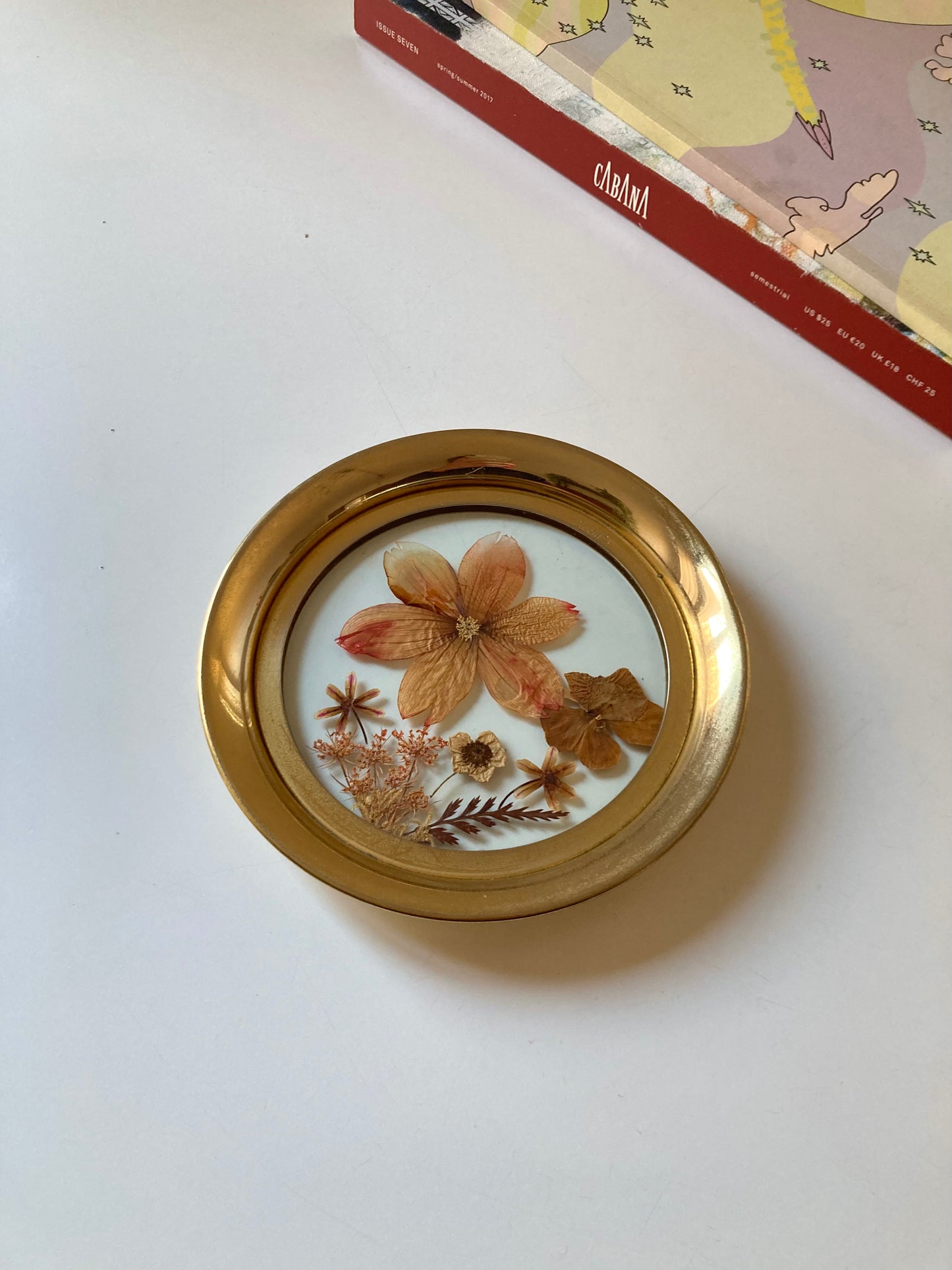 Vintage saucer with dried flowers