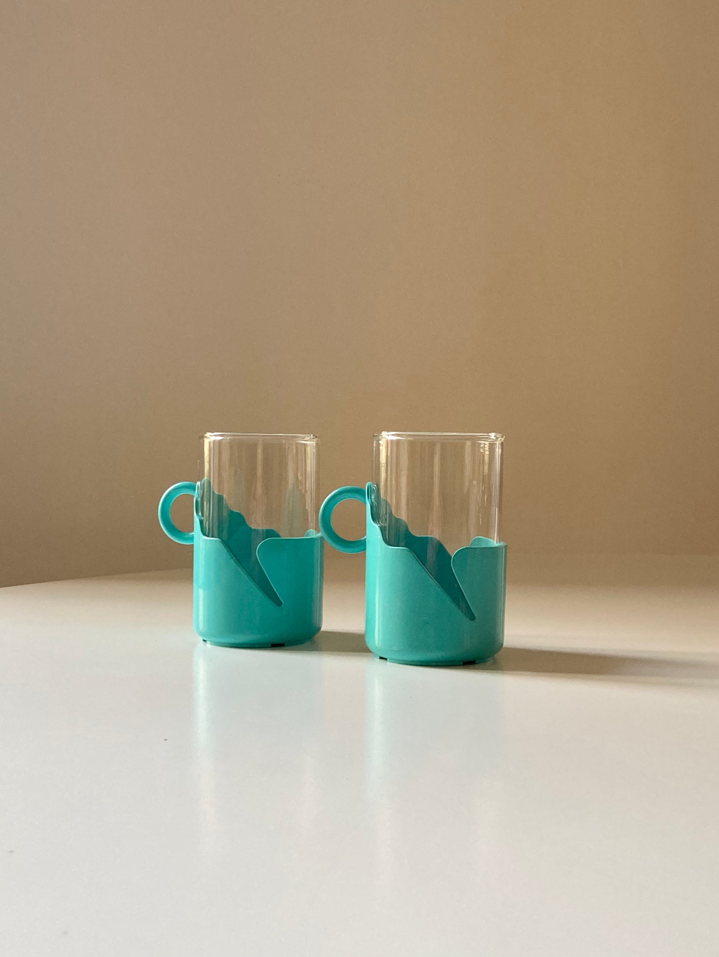 Pair of turquoise space age cups