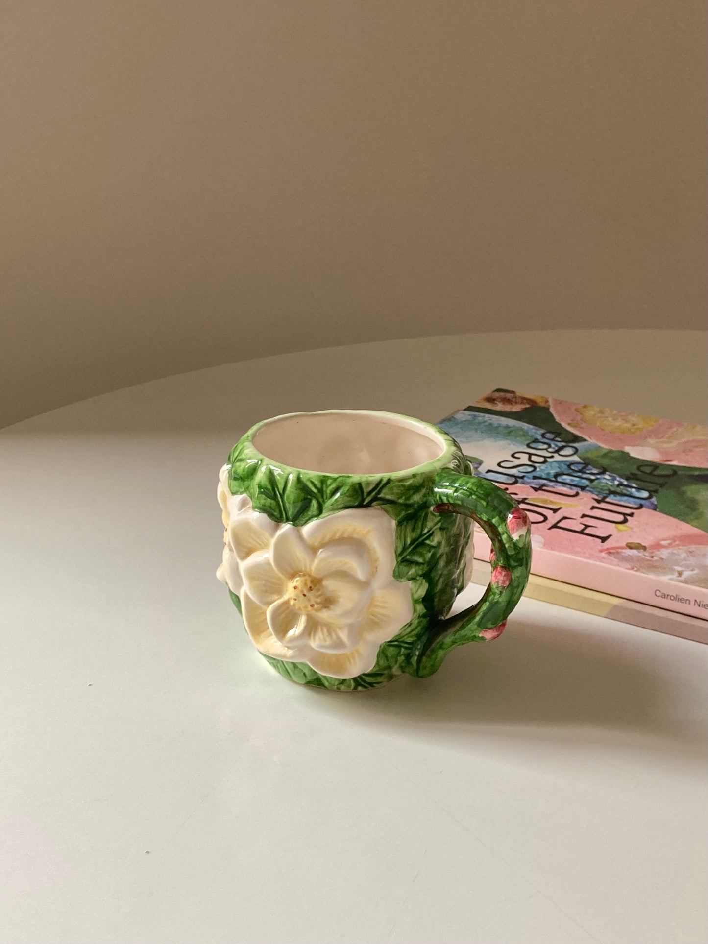 Ceramic mug with white flower