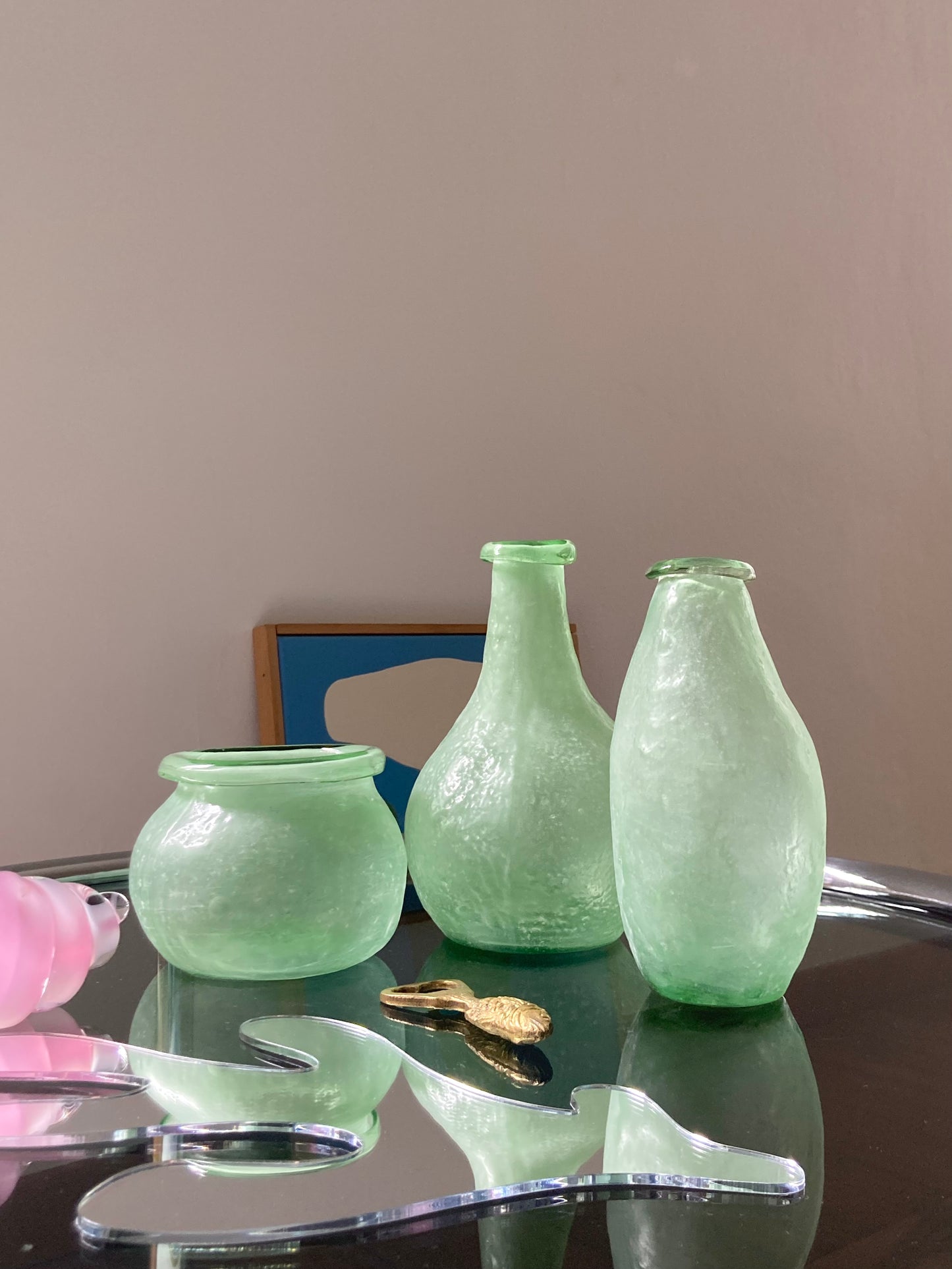 Trio asymmetric vases in green glass