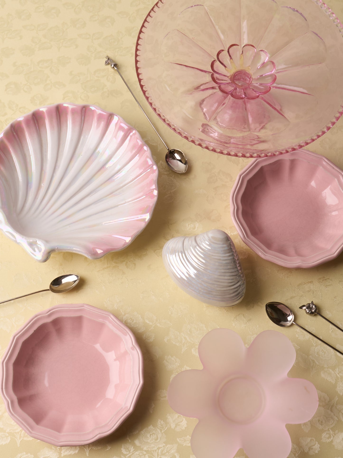 Pink glass cake stand with petal motif