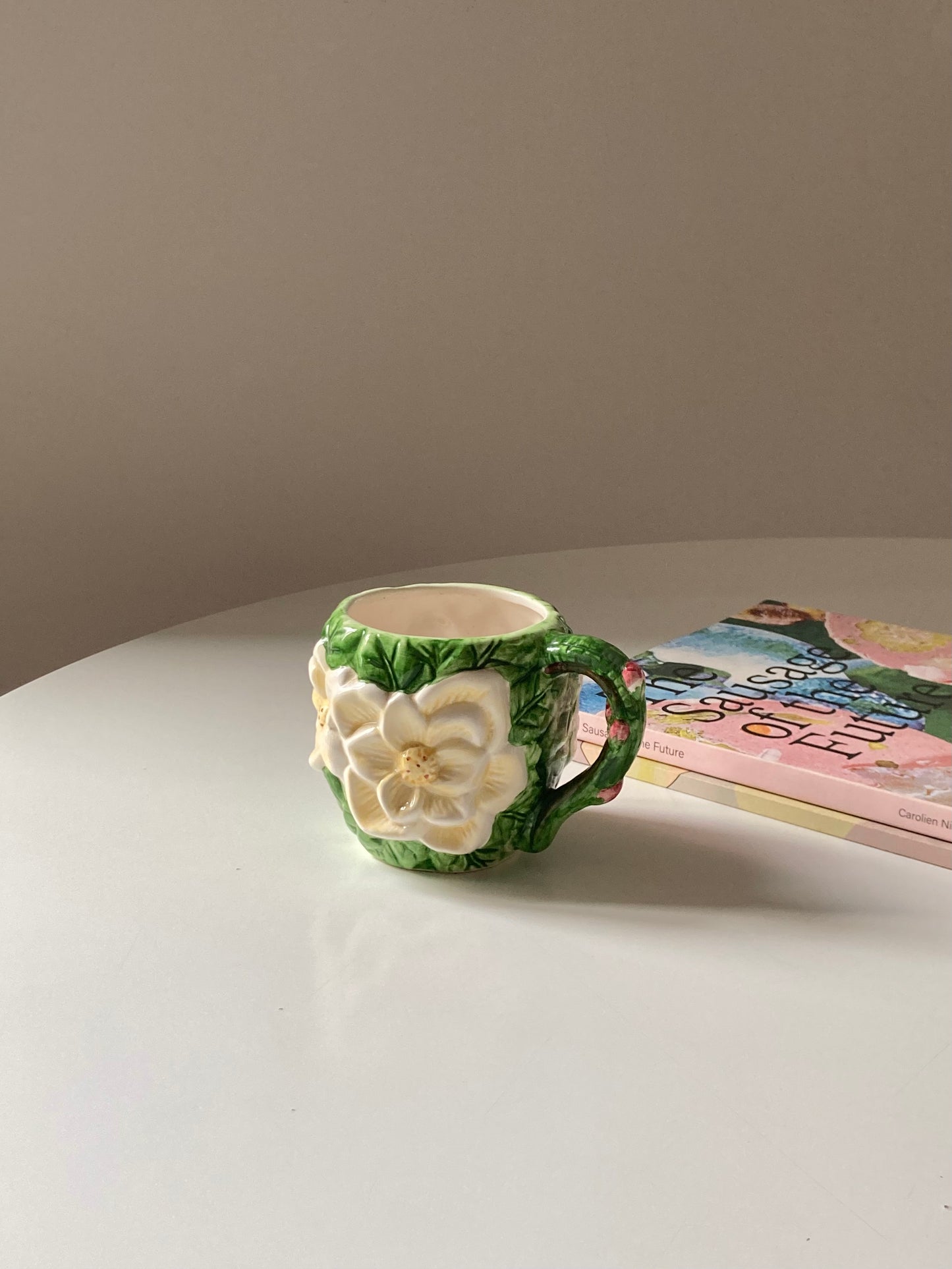 Ceramic mug with white flower