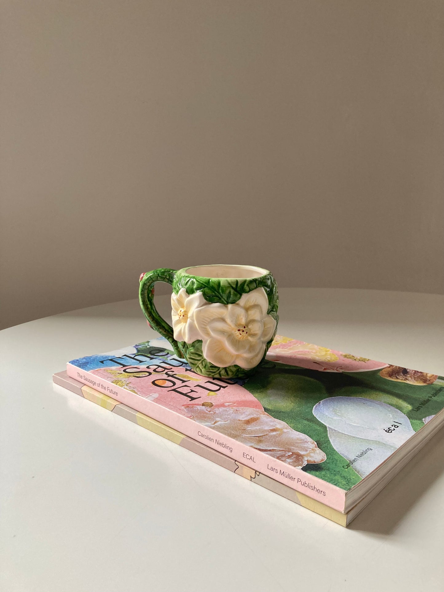 Ceramic mug with white flower