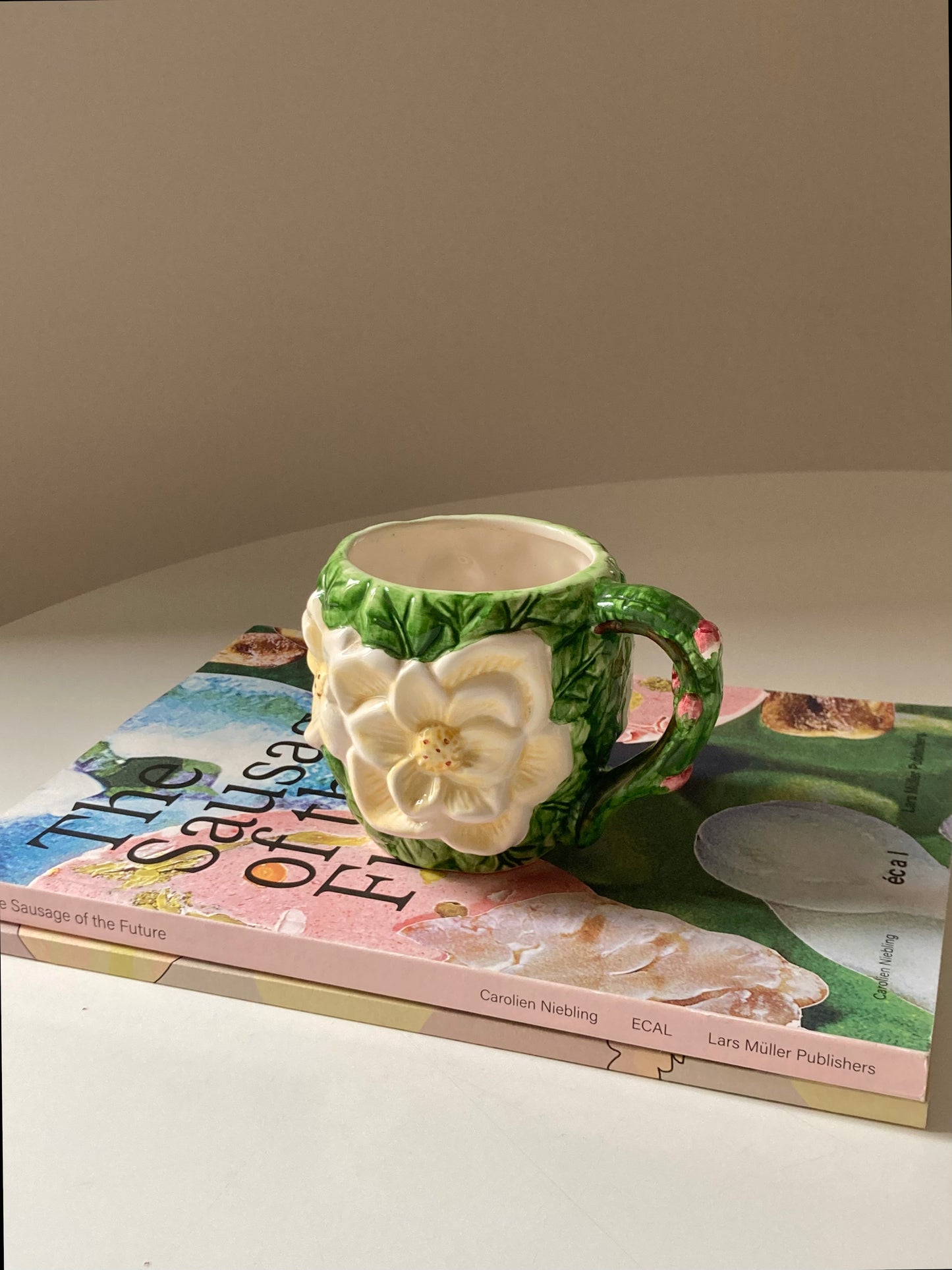 Ceramic mug with white flower