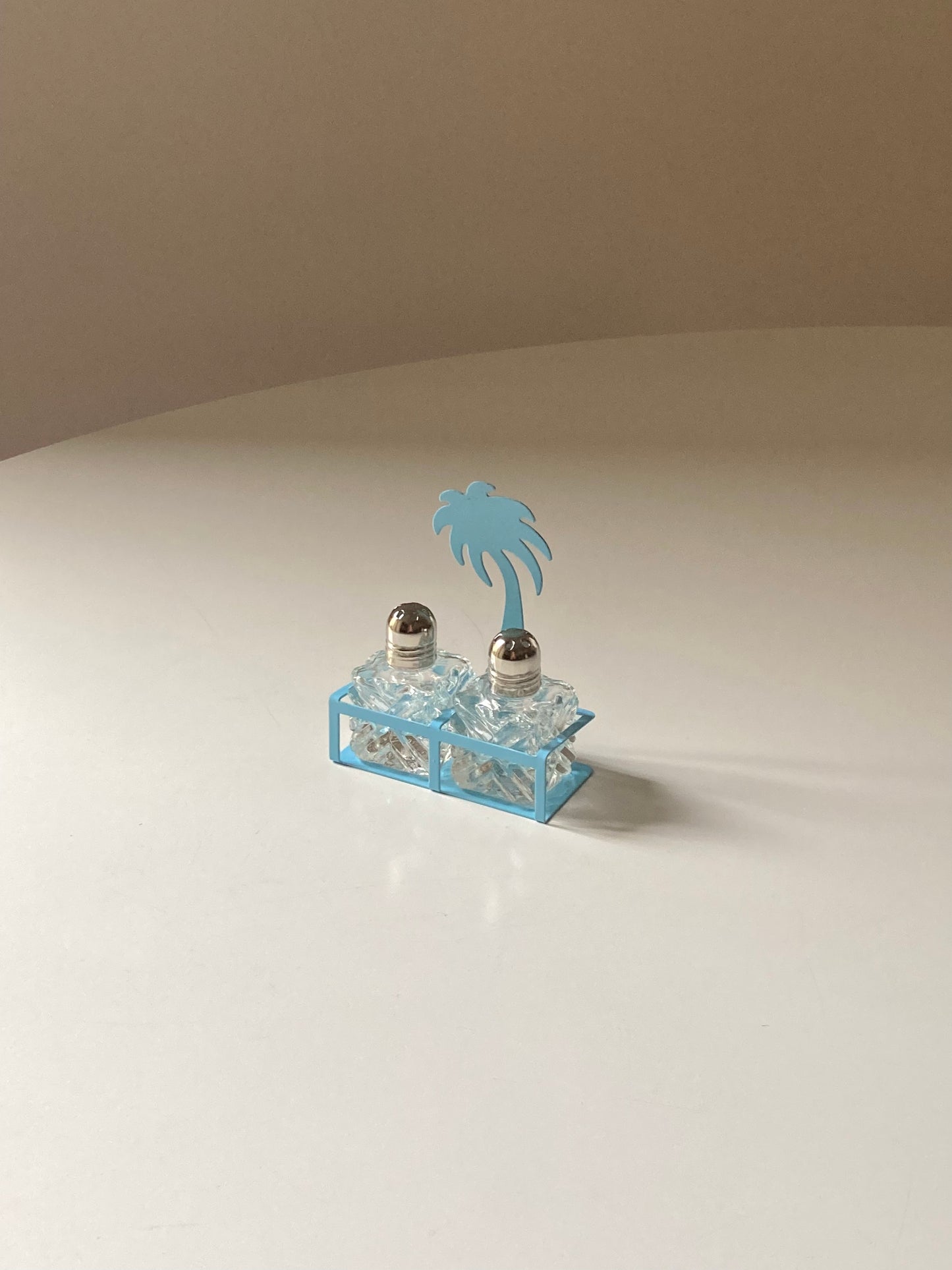 Pair of palm-shaped salt and pepper shakers