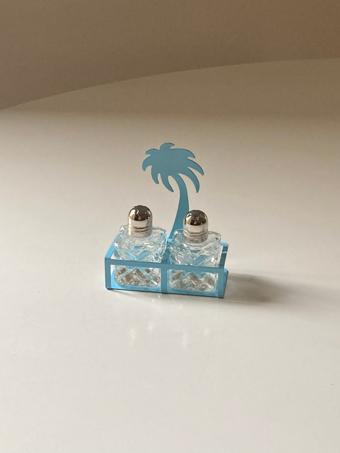 Pair of palm-shaped salt and pepper shakers