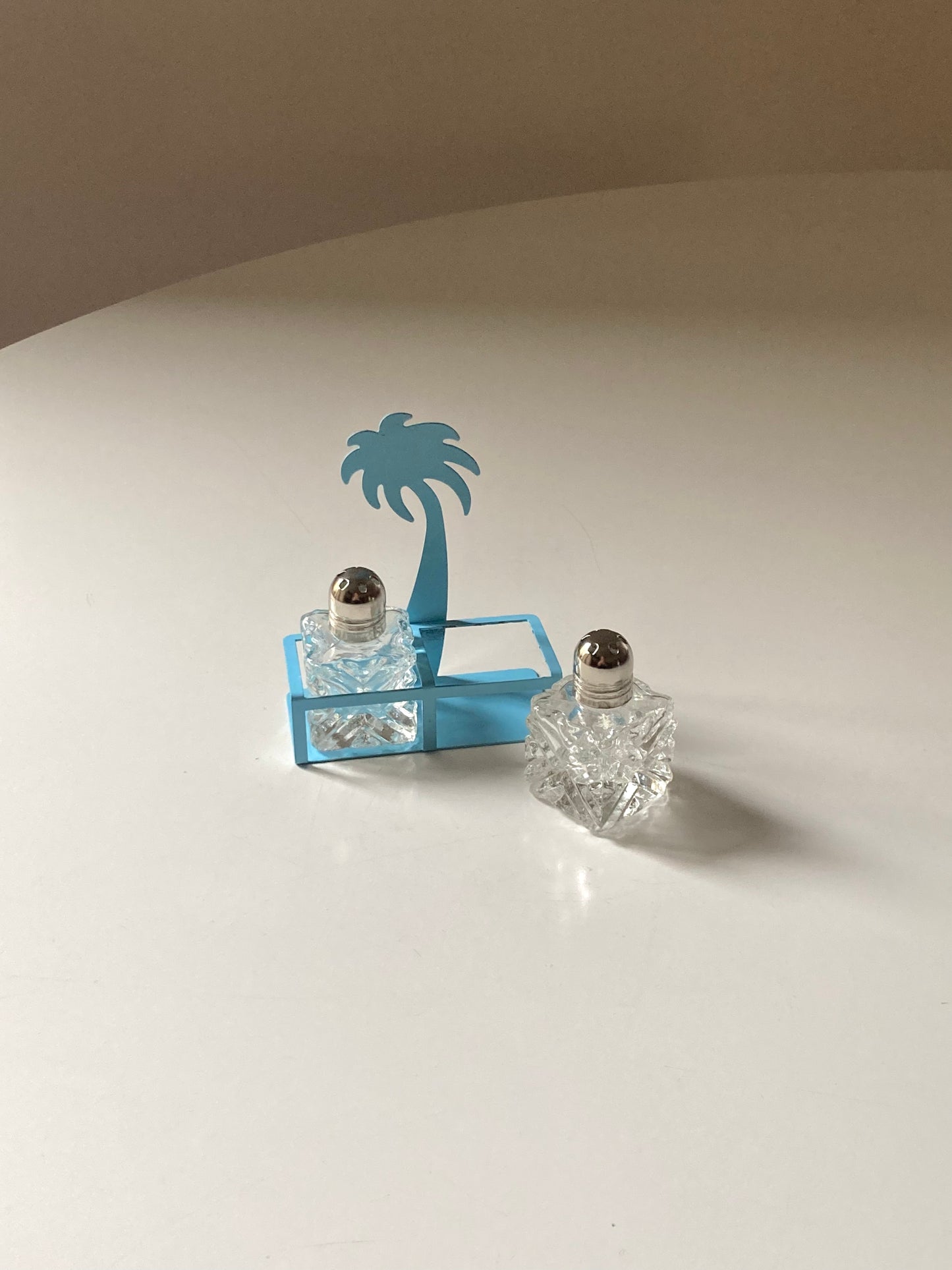 Pair of palm-shaped salt and pepper shakers