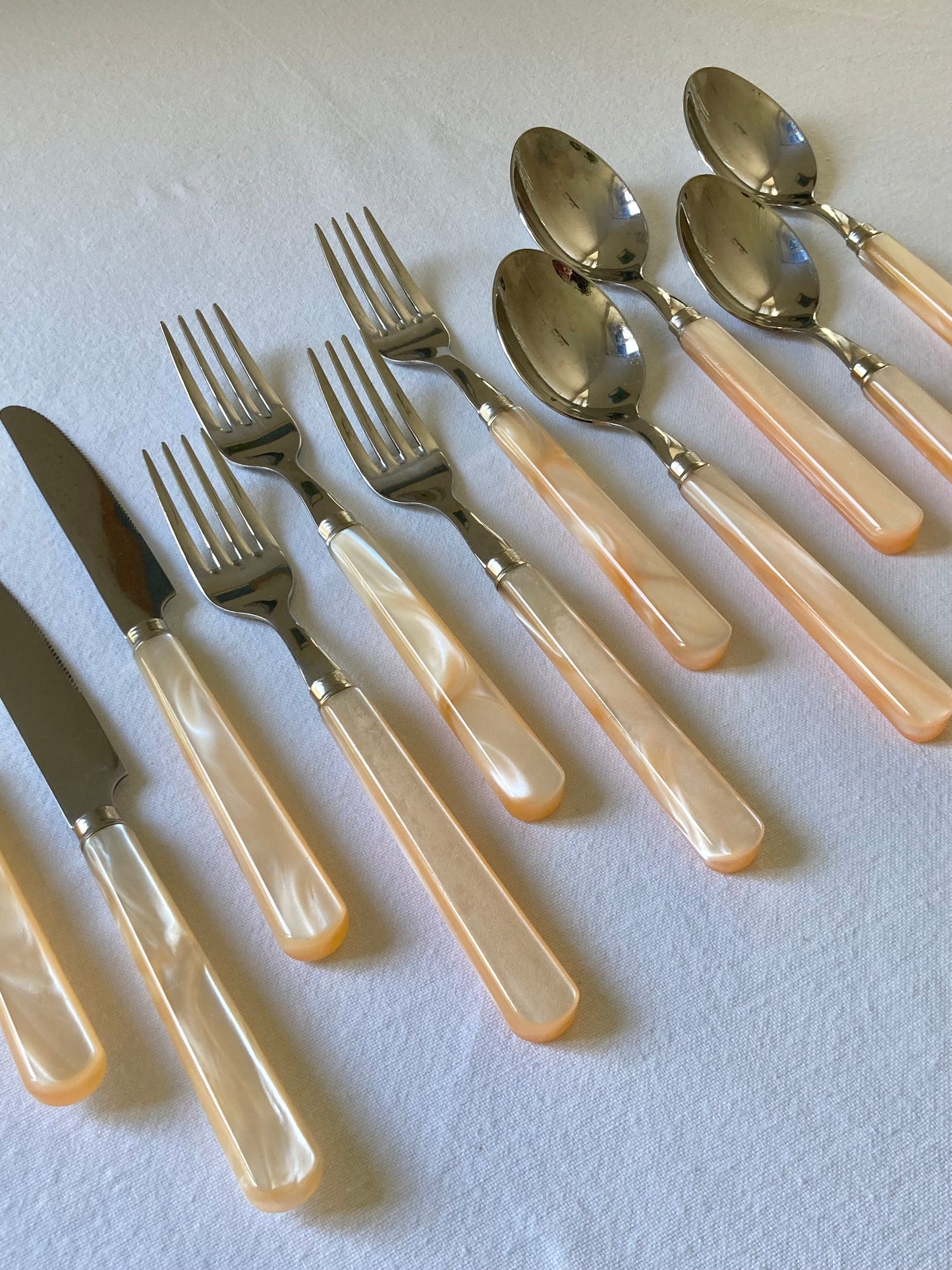 Pearly ivory colored table cutlery and dessert service