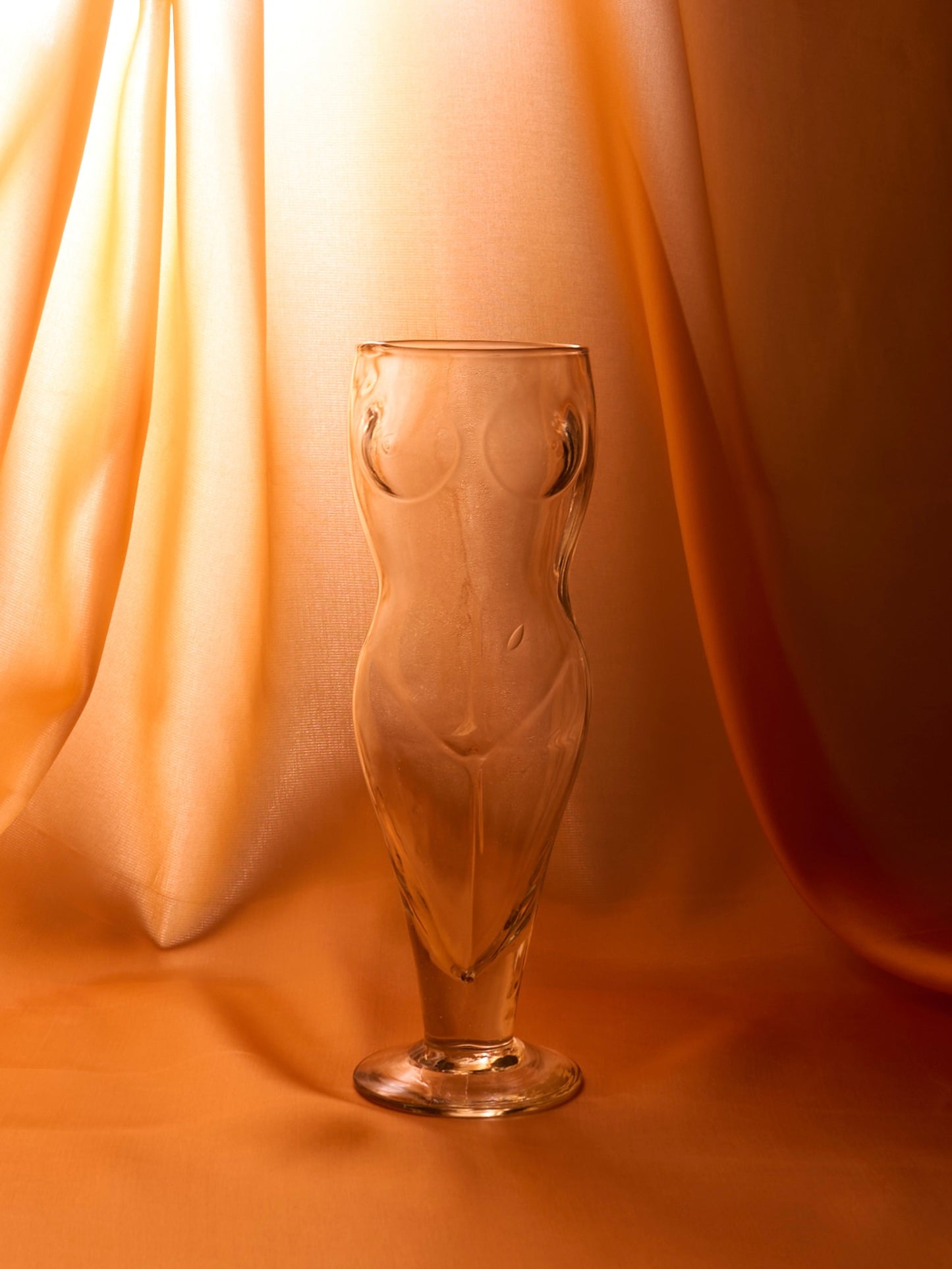 Tall glasses in the shape of a female body