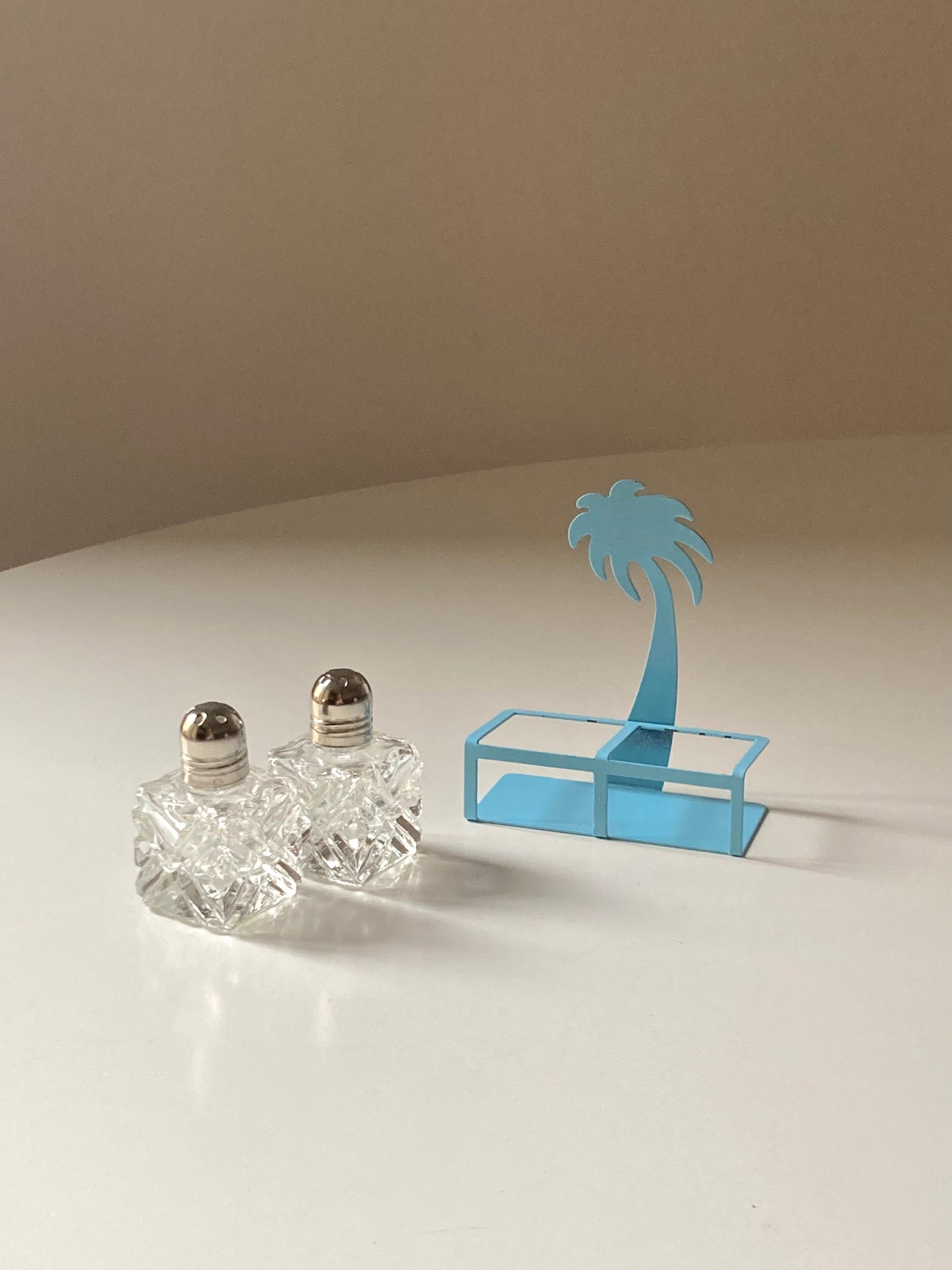 Pair of palm-shaped salt and pepper shakers