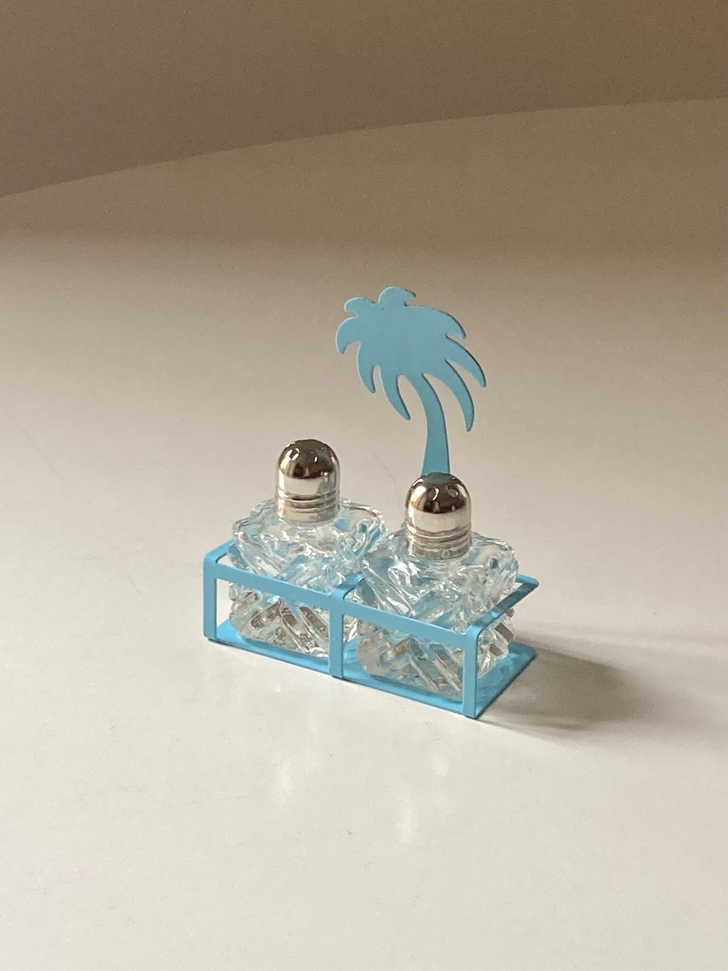 Pair of palm-shaped salt and pepper shakers