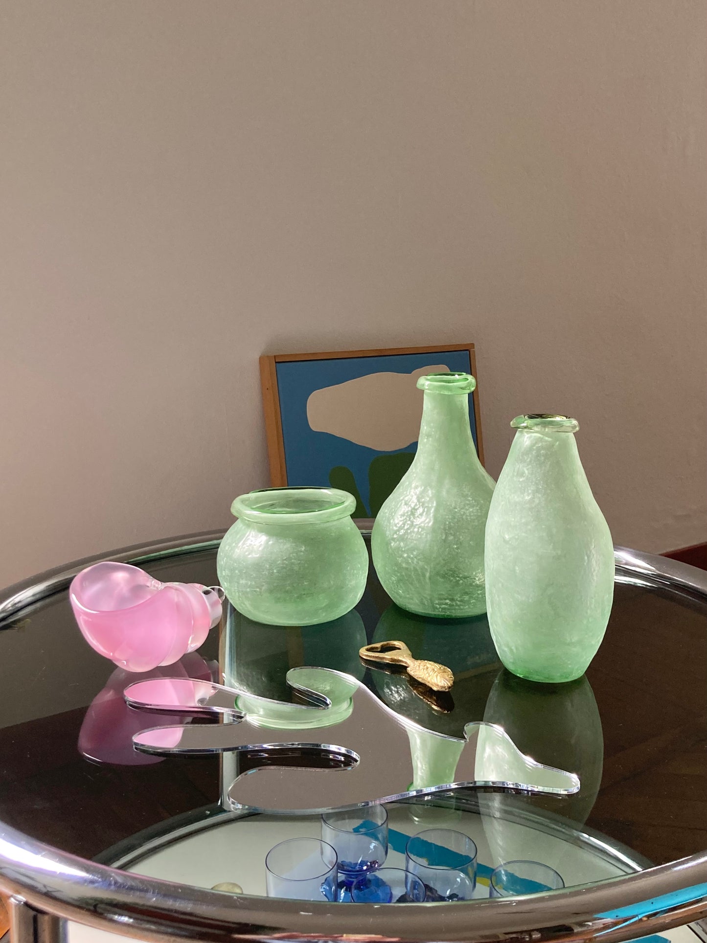 Trio asymmetric vases in green glass