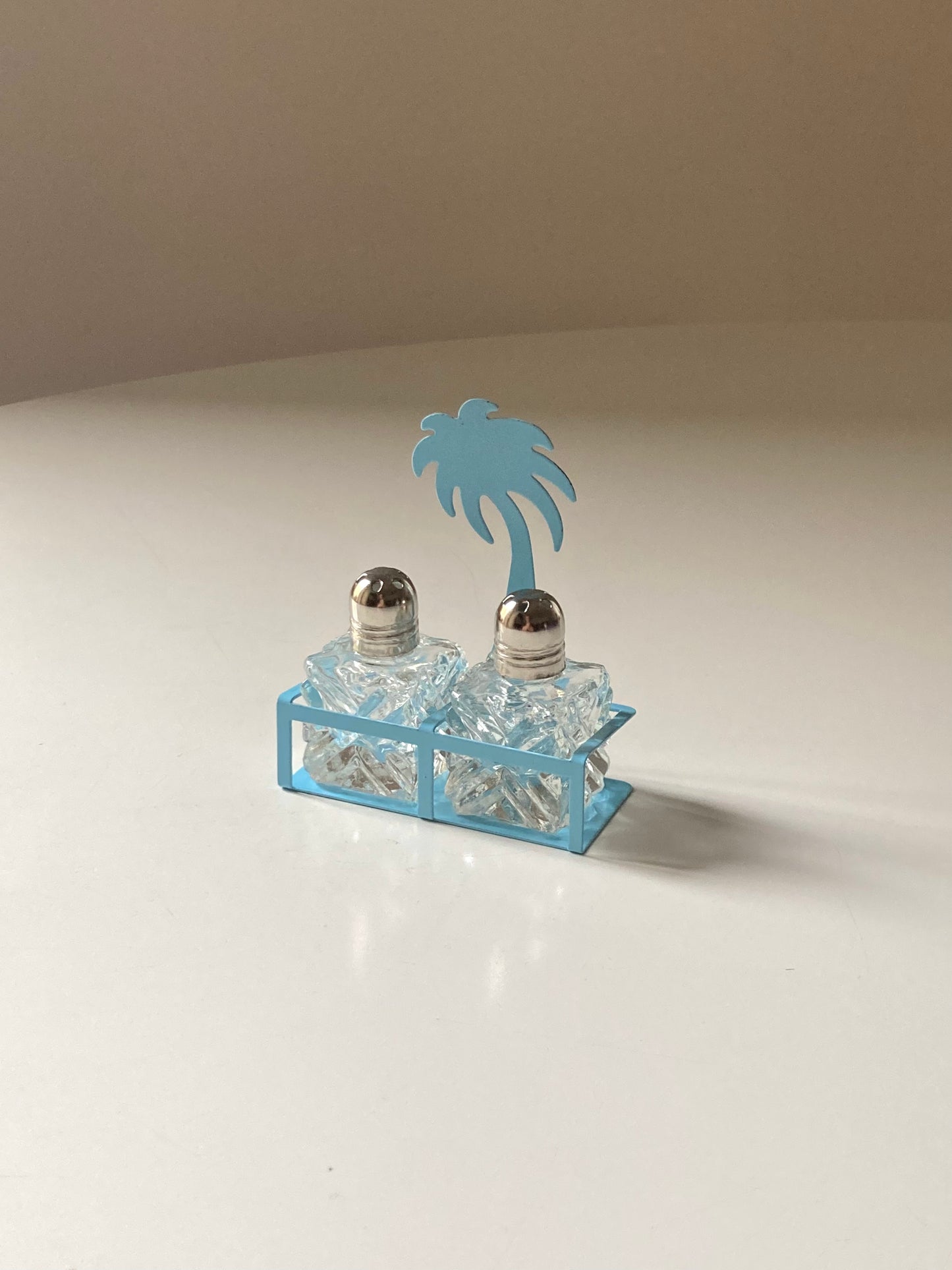 Pair of palm-shaped salt and pepper shakers