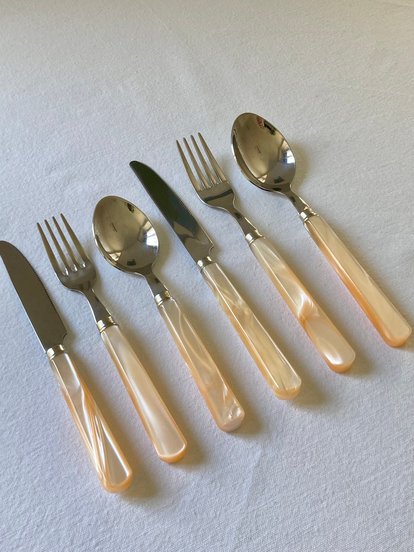 Pearly ivory colored table cutlery and dessert service