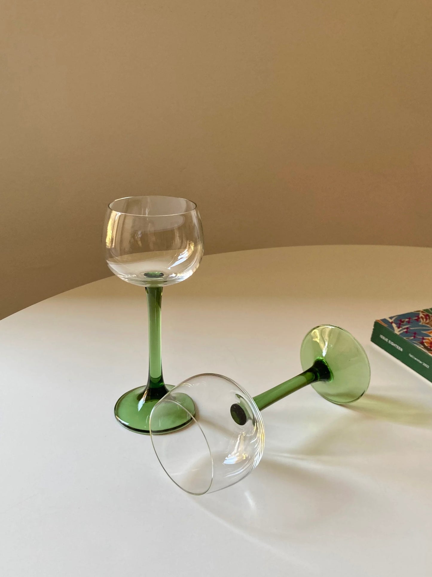 Pair of green tall stem glasses