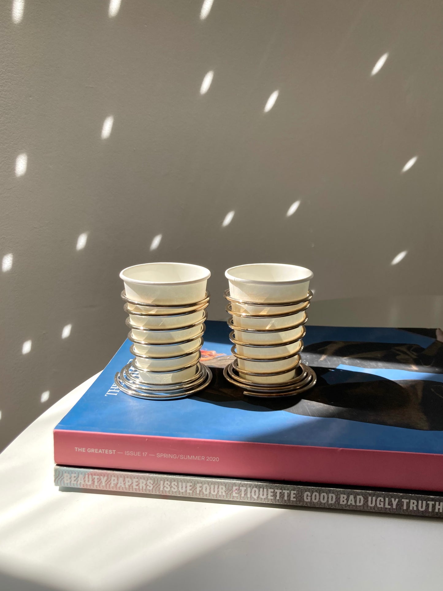 Spring loaded metal cup holder set