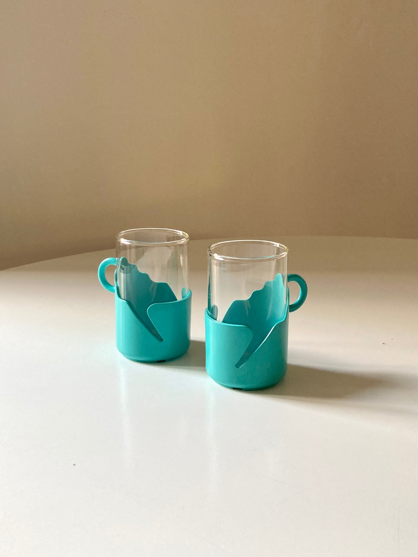 Pair of turquoise space age cups