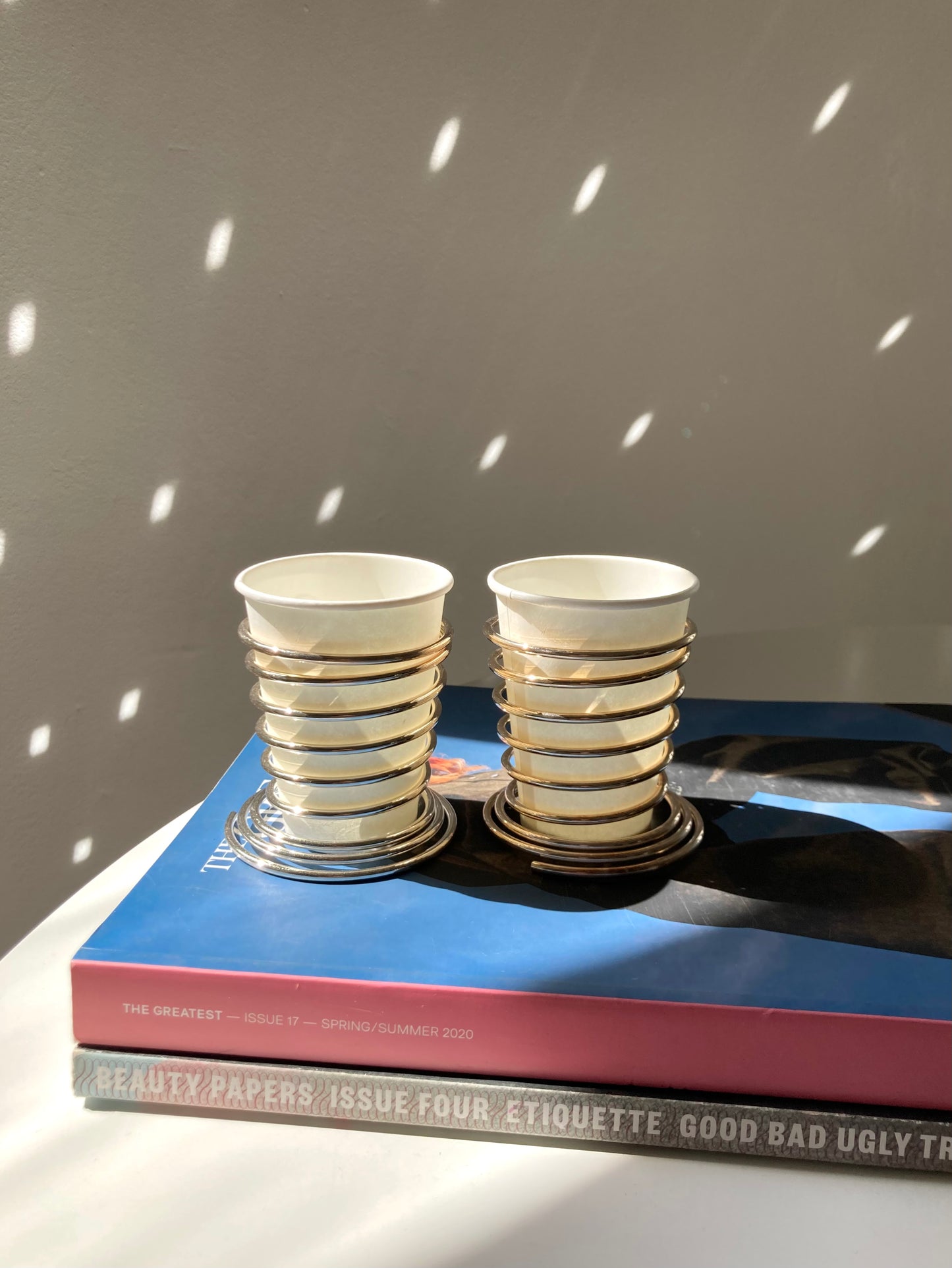 Spring loaded metal cup holder set