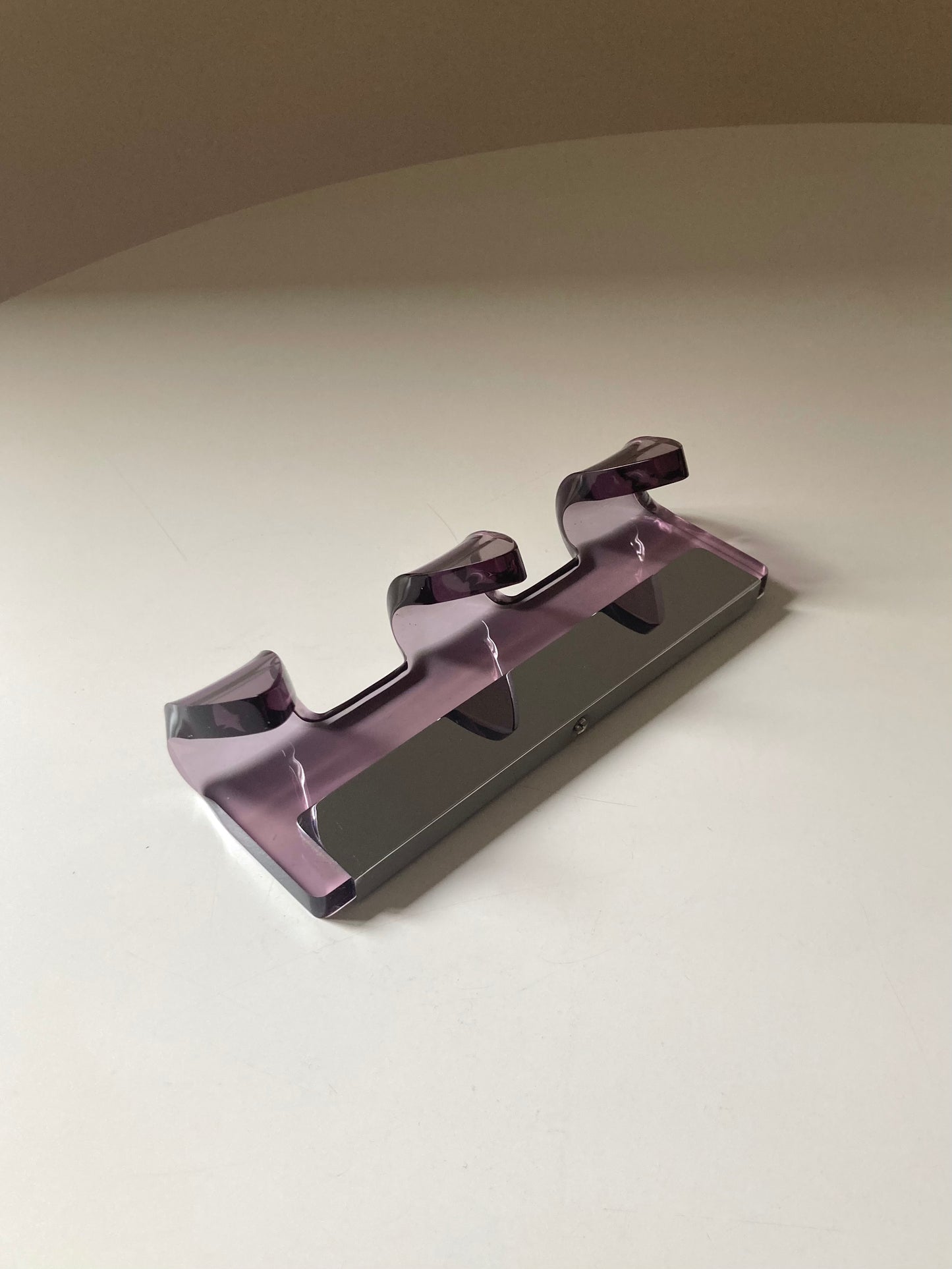 Mauve colored designer coat hanger