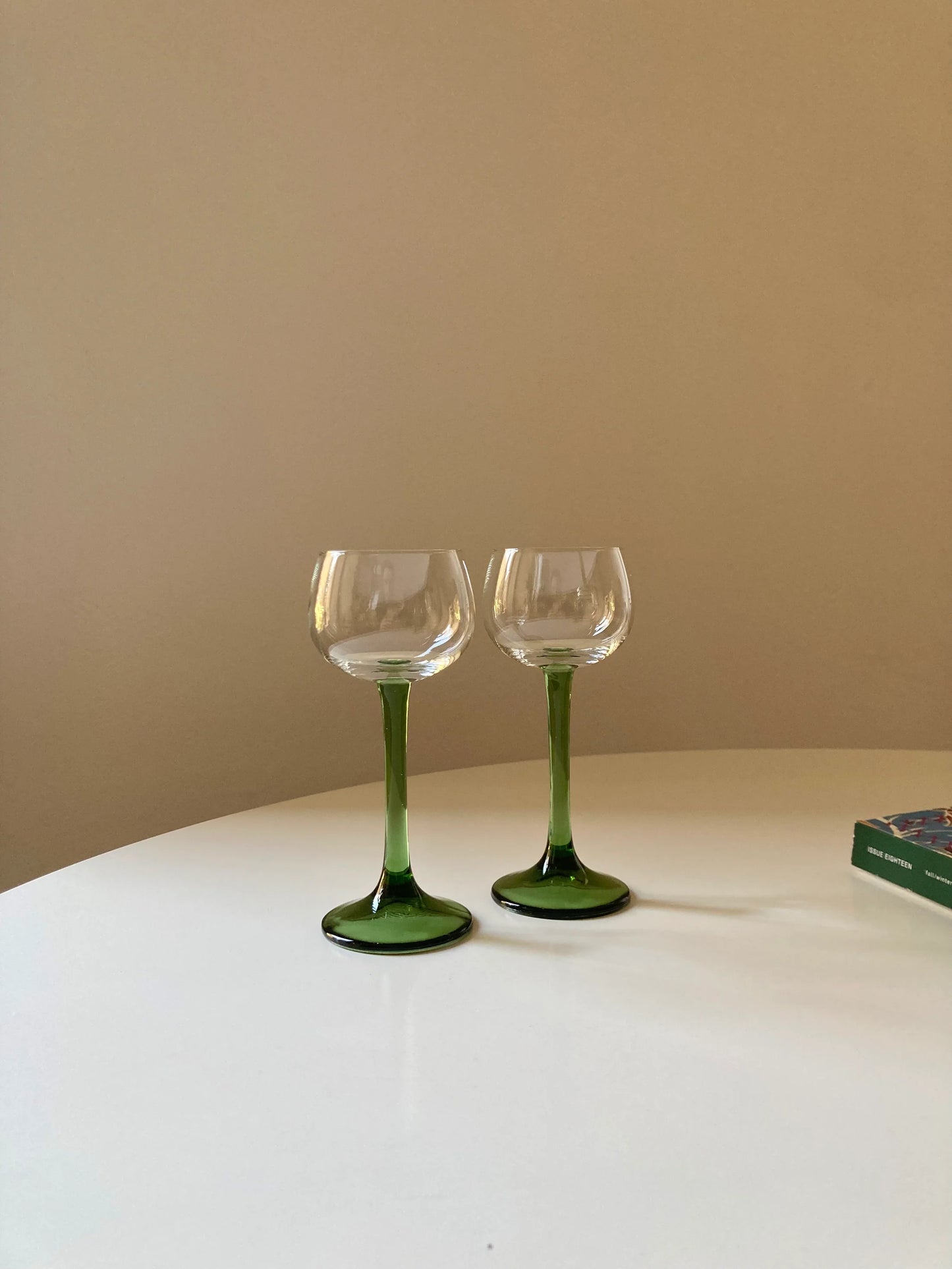 Pair of green tall stem glasses