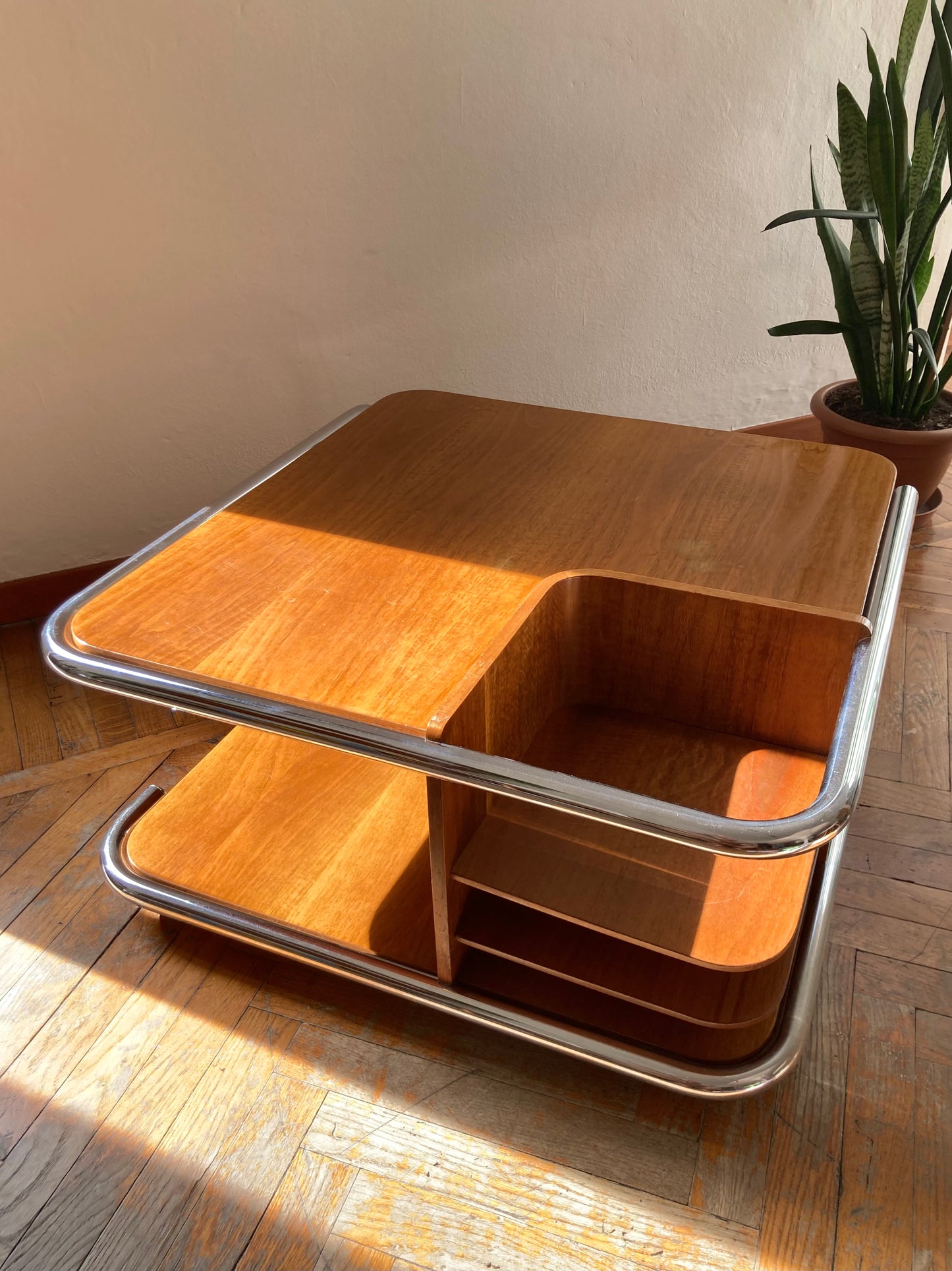 Square wooden coffee table with chromed profile