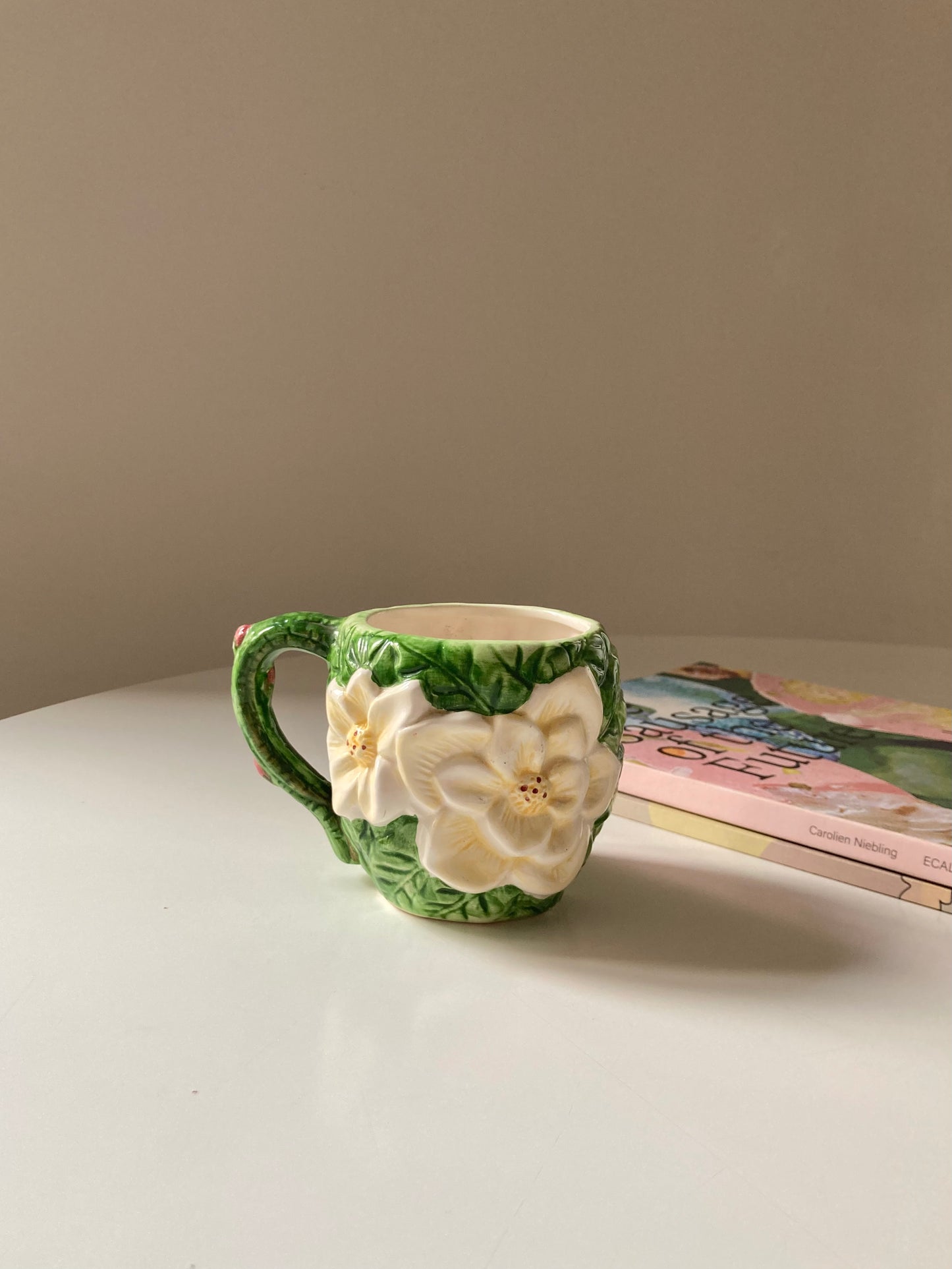 Ceramic mug with white flower