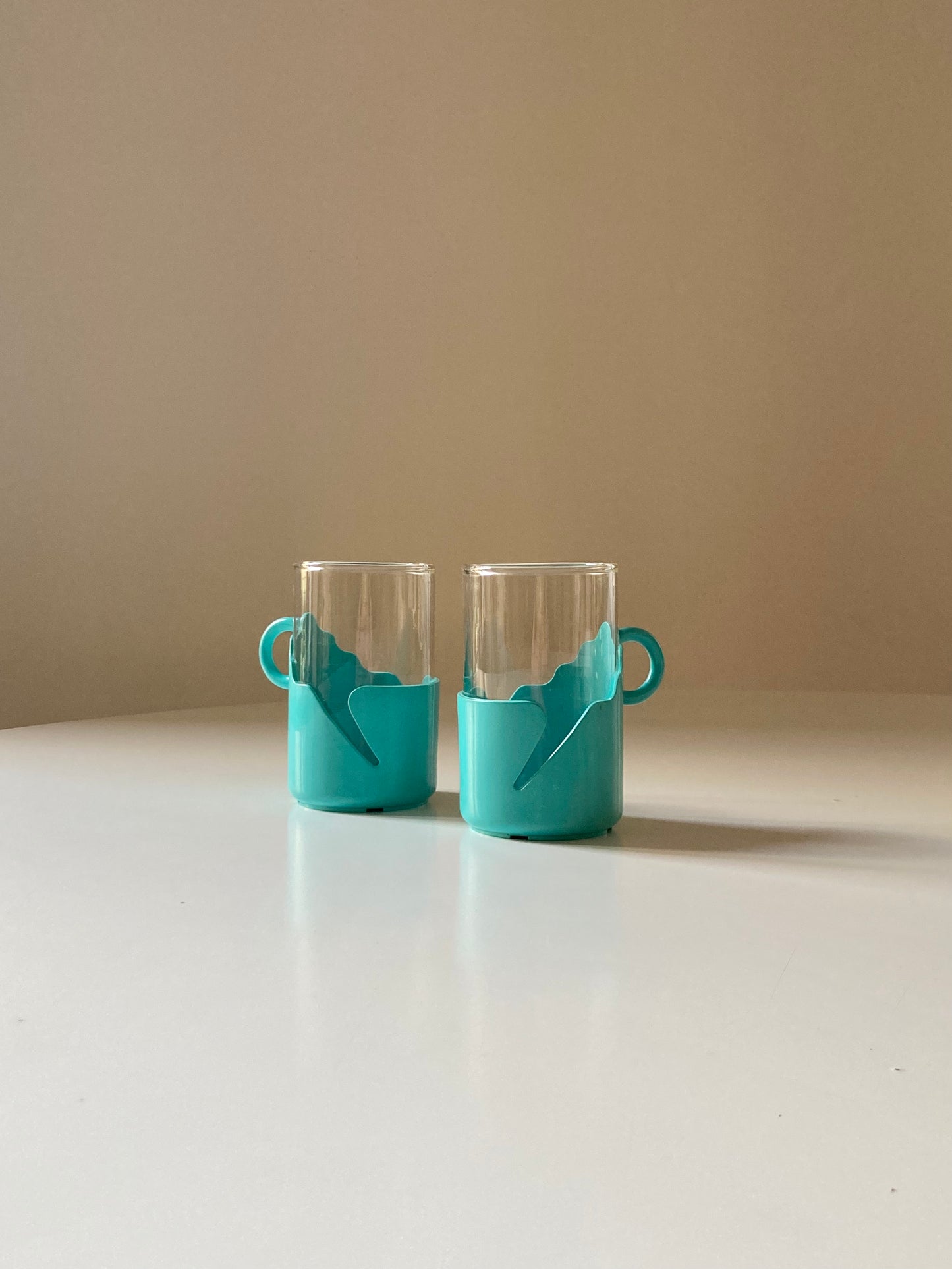 Pair of turquoise space age cups