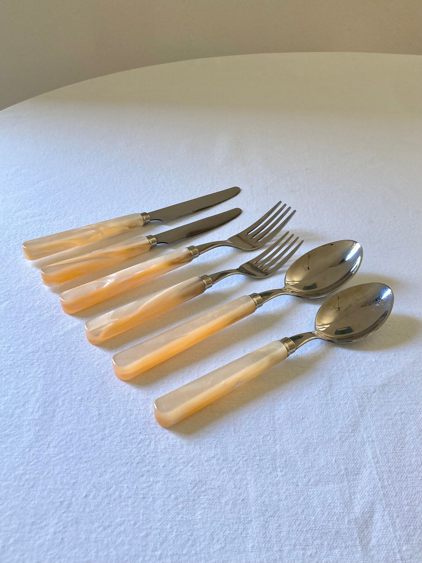 Pearly ivory colored table cutlery and dessert service