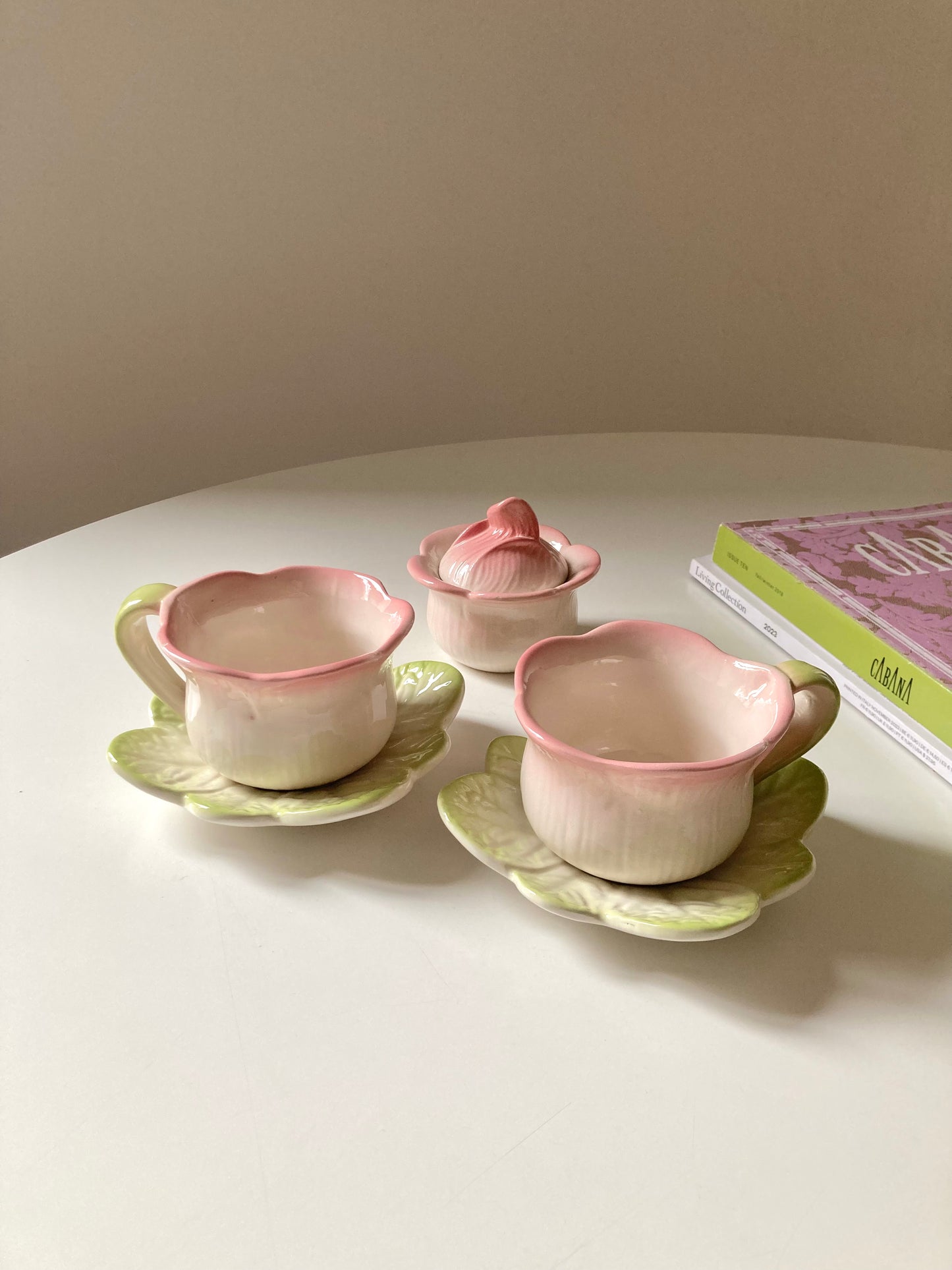 Pair of teacups with sugar bowl