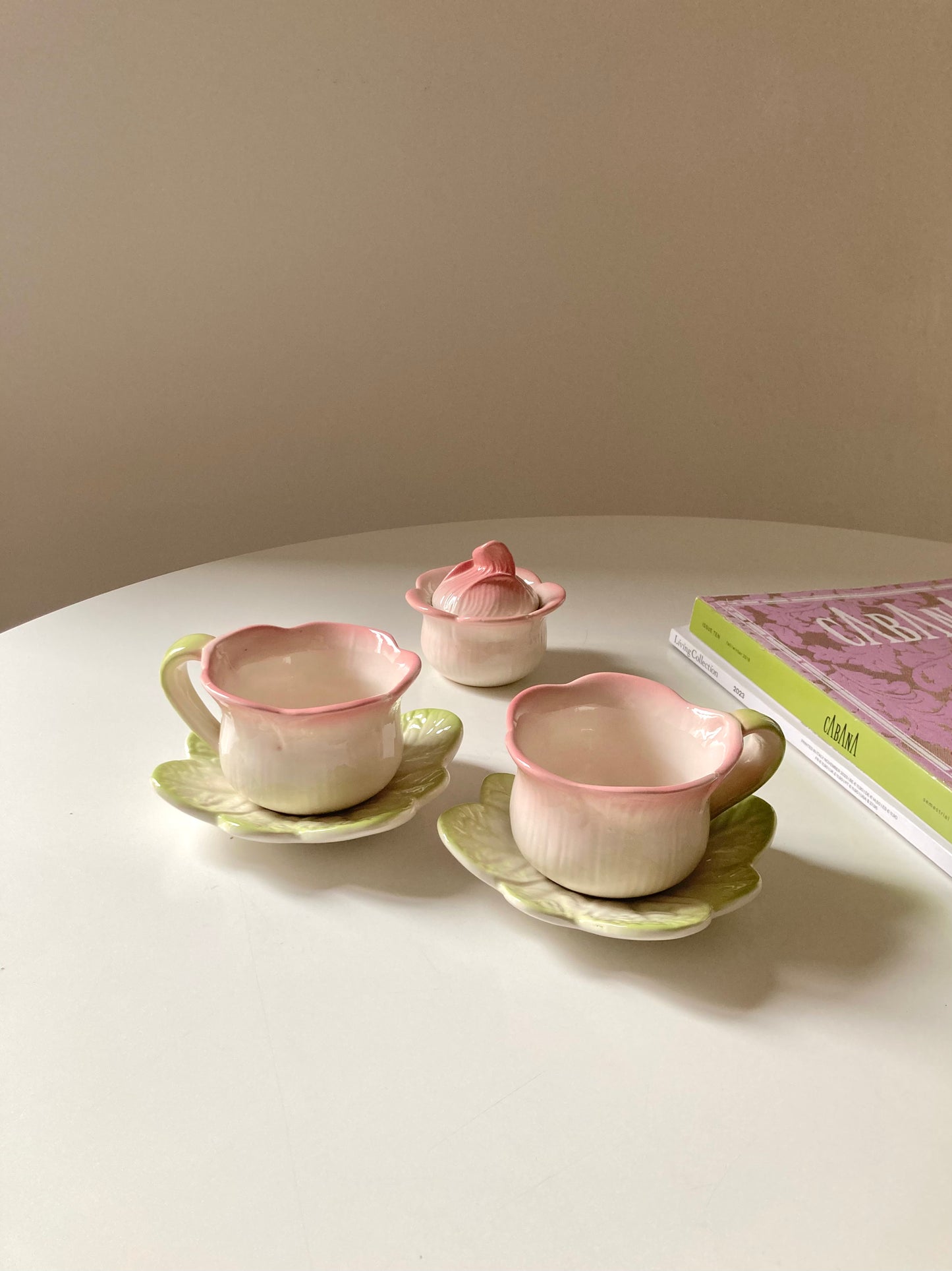 Pair of teacups with sugar bowl