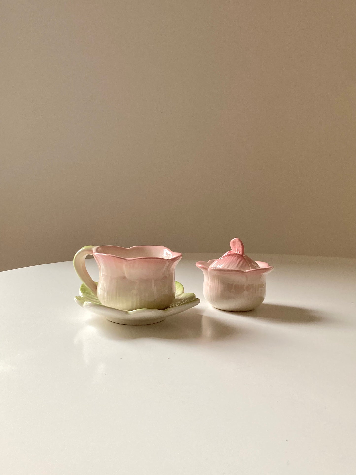 Pair of teacups with sugar bowl