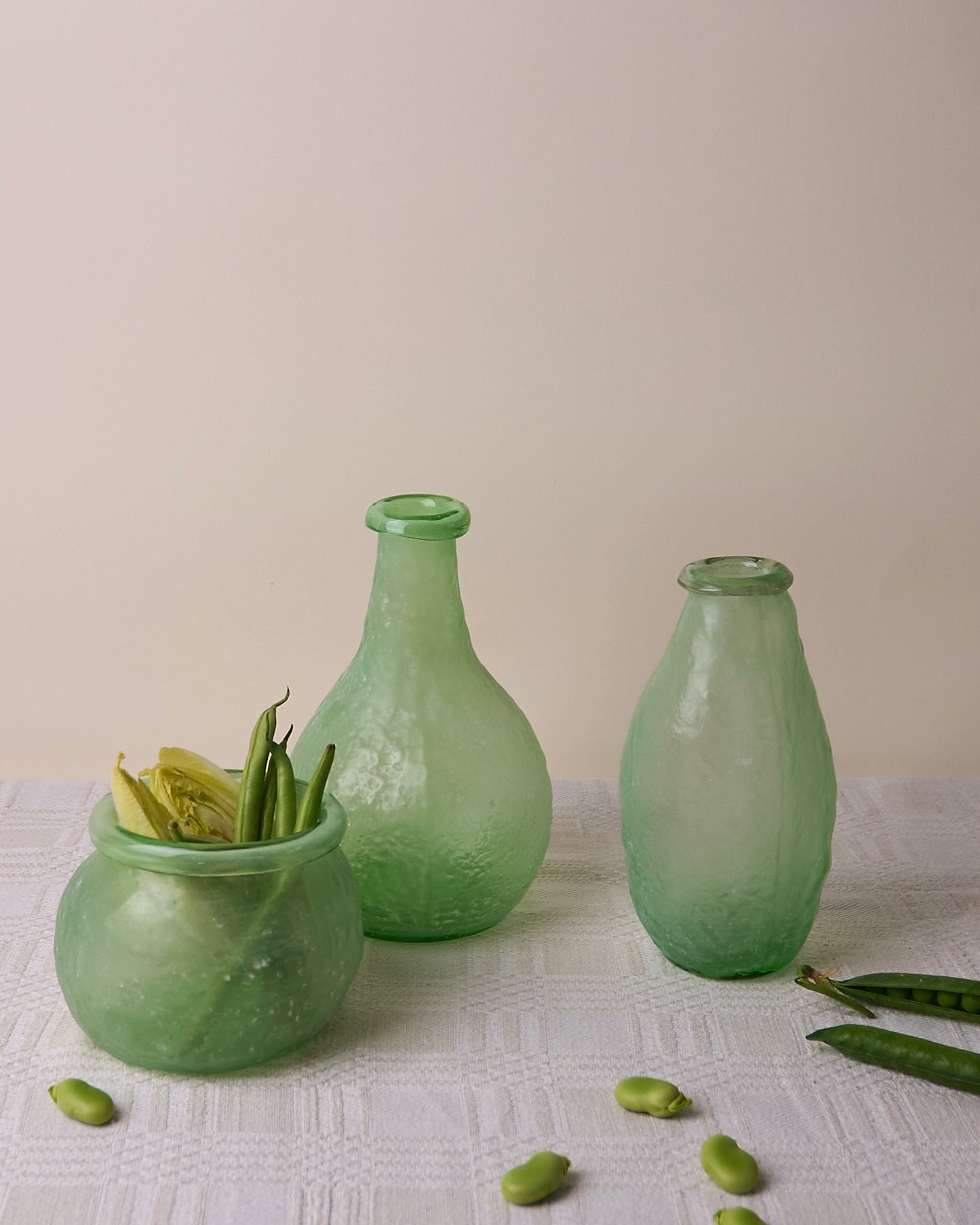 Trio asymmetric vases in green glass