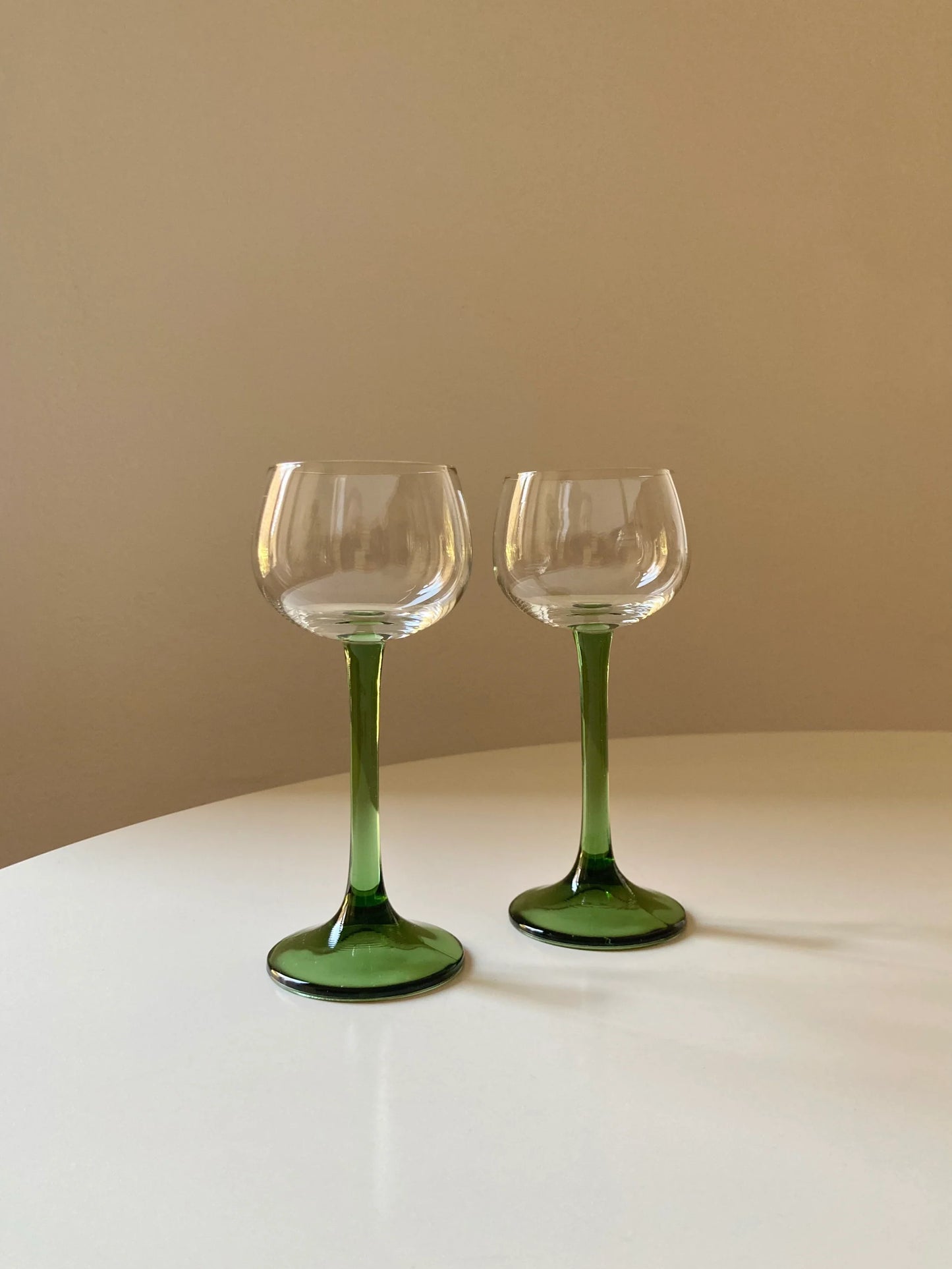 Pair of green tall stem glasses