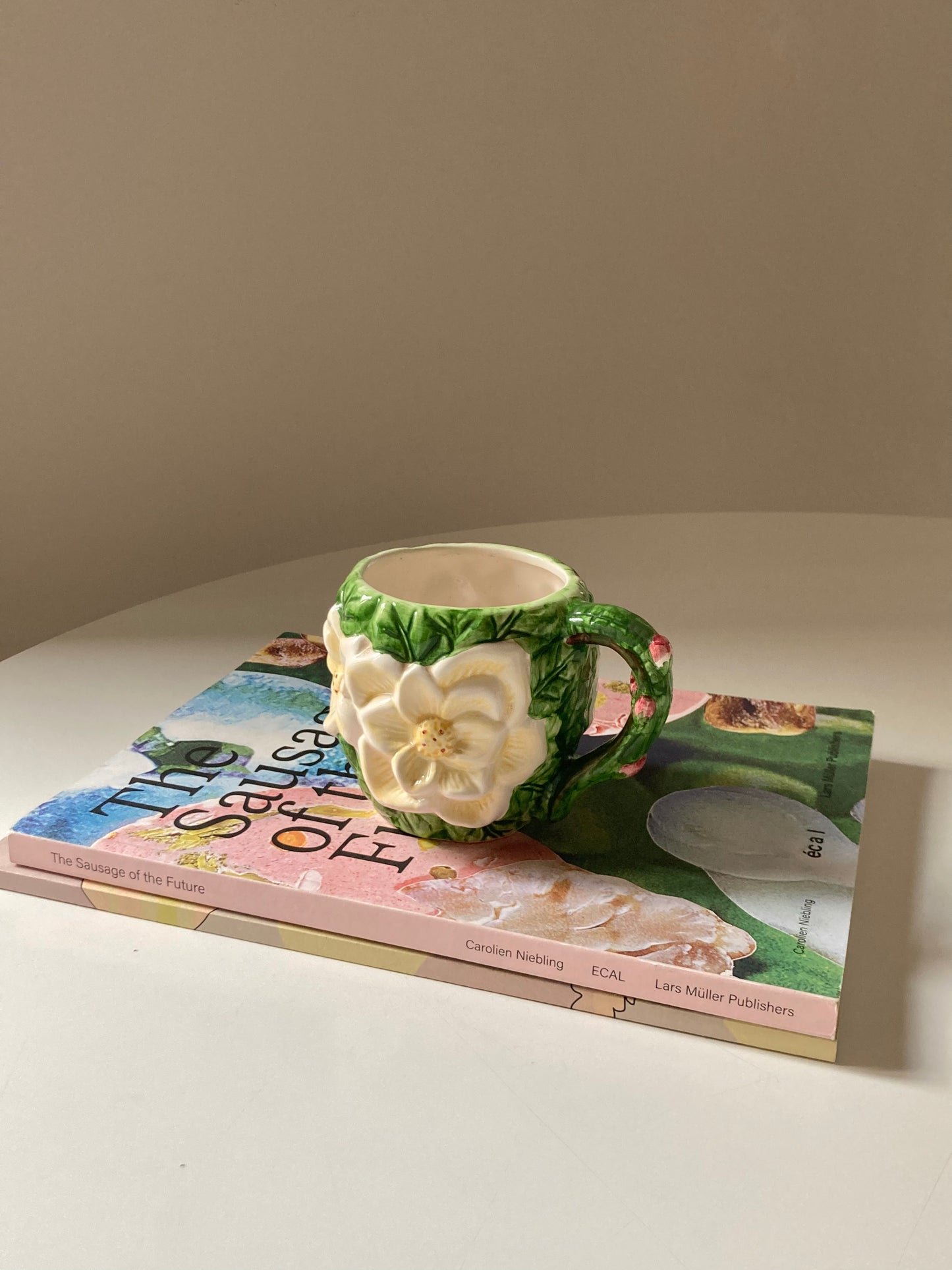 Ceramic mug with white flower