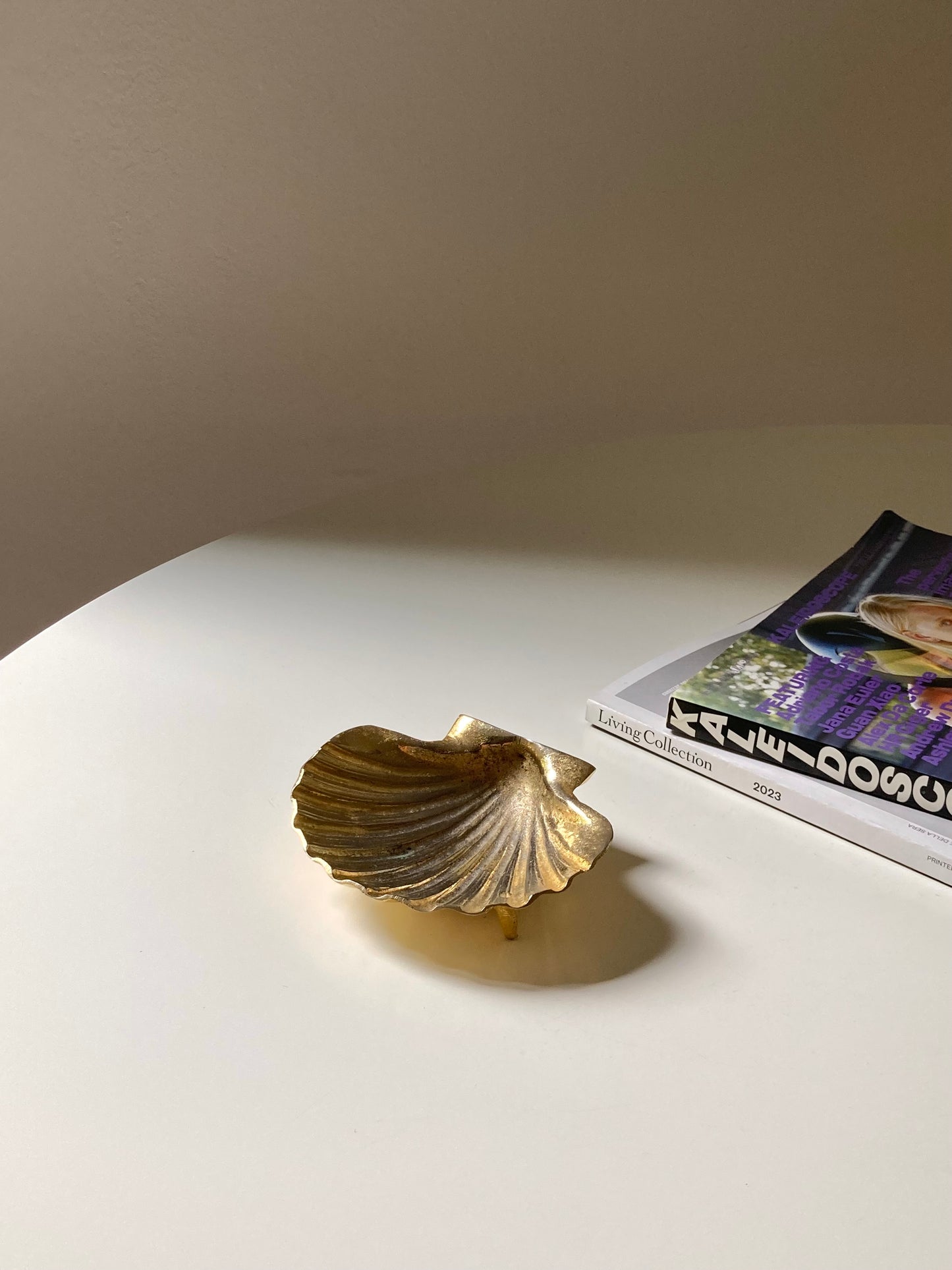 Golden shell-shaped ashtray