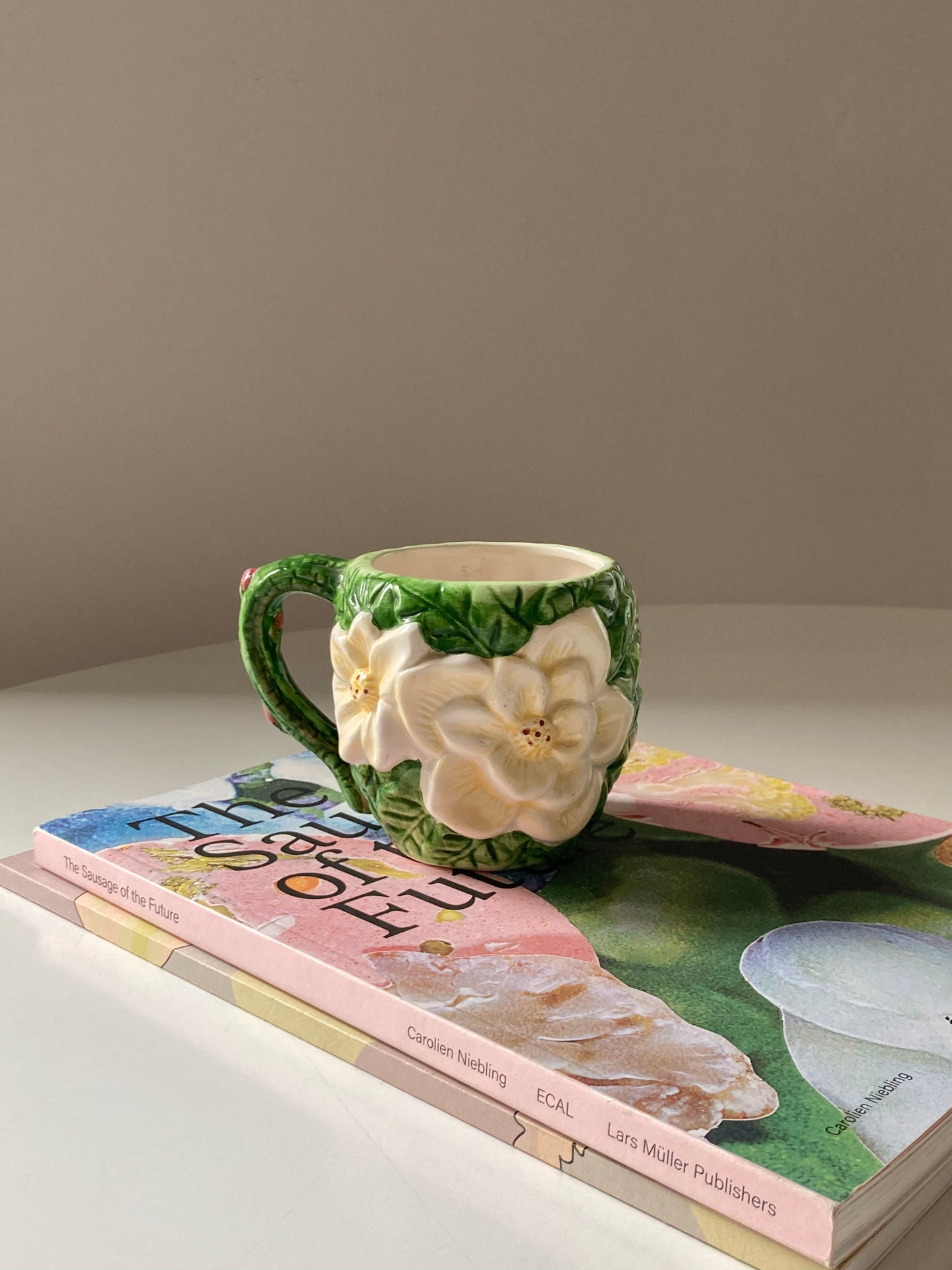 Ceramic mug with white flower